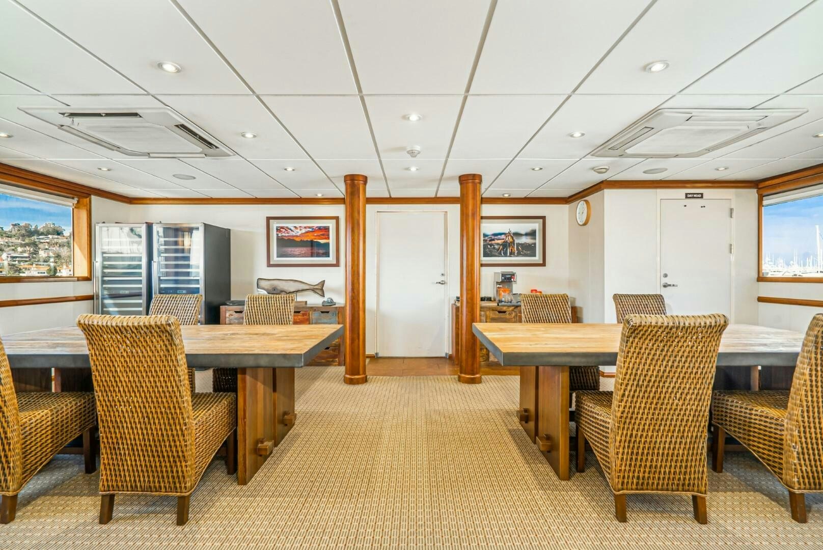 a room with chairs and tables aboard PACIFIC PROVIDER Yacht for Sale