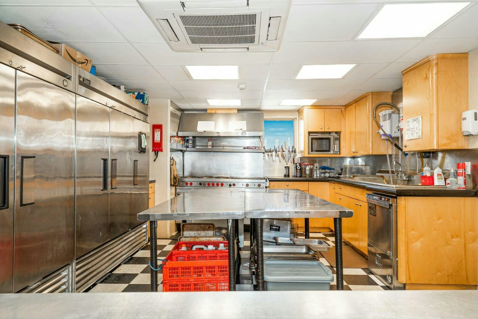 a kitchen with stainless steel appliances aboard PACIFIC PROVIDER Yacht for Sale