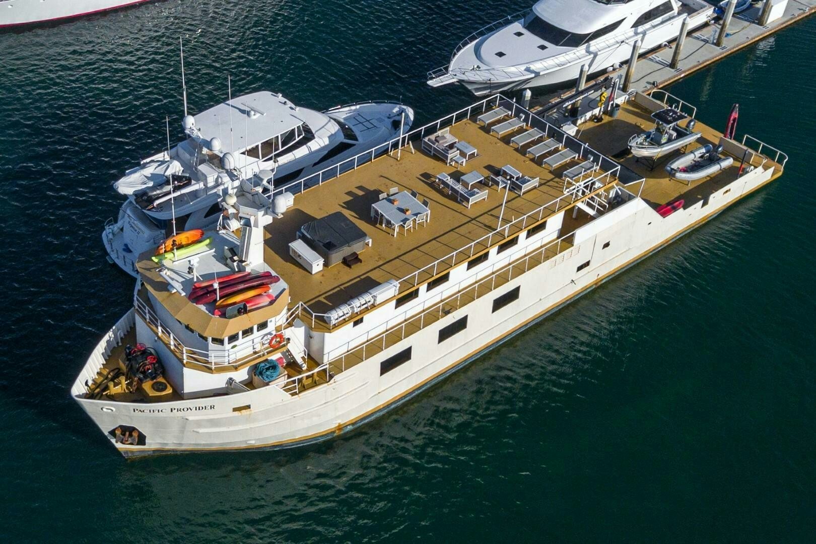 a large ship in the water aboard PACIFIC PROVIDER Yacht for Sale