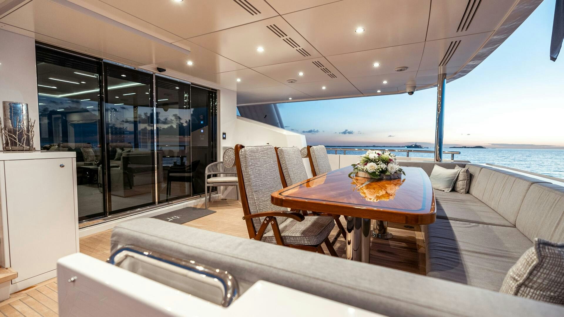 a room with a table and chairs aboard ROMEO FOXTROT Yacht for Sale