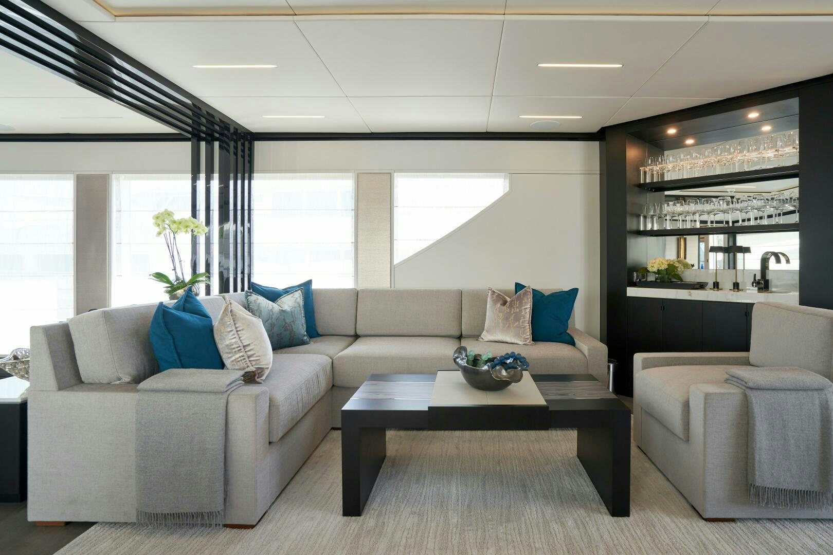 a living room with a couch and a coffee table aboard ROMEO FOXTROT Yacht for Sale