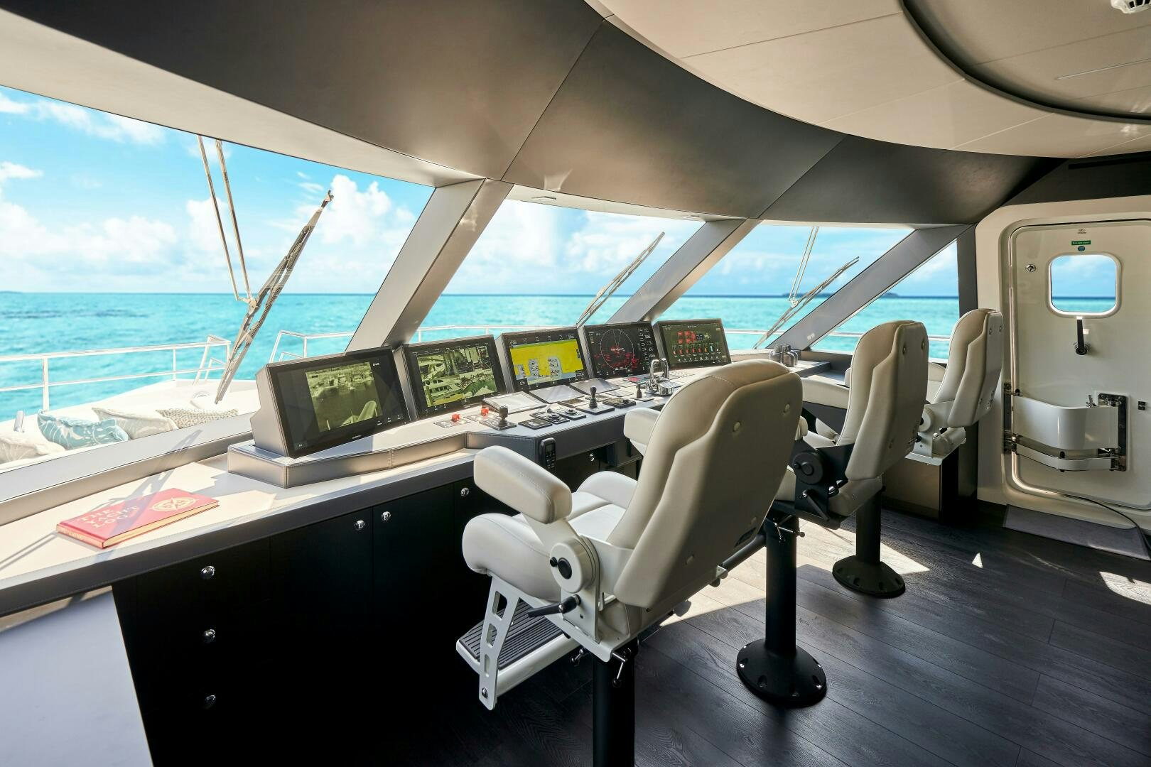 a room with many computers and monitors aboard ROMEO FOXTROT Yacht for Sale