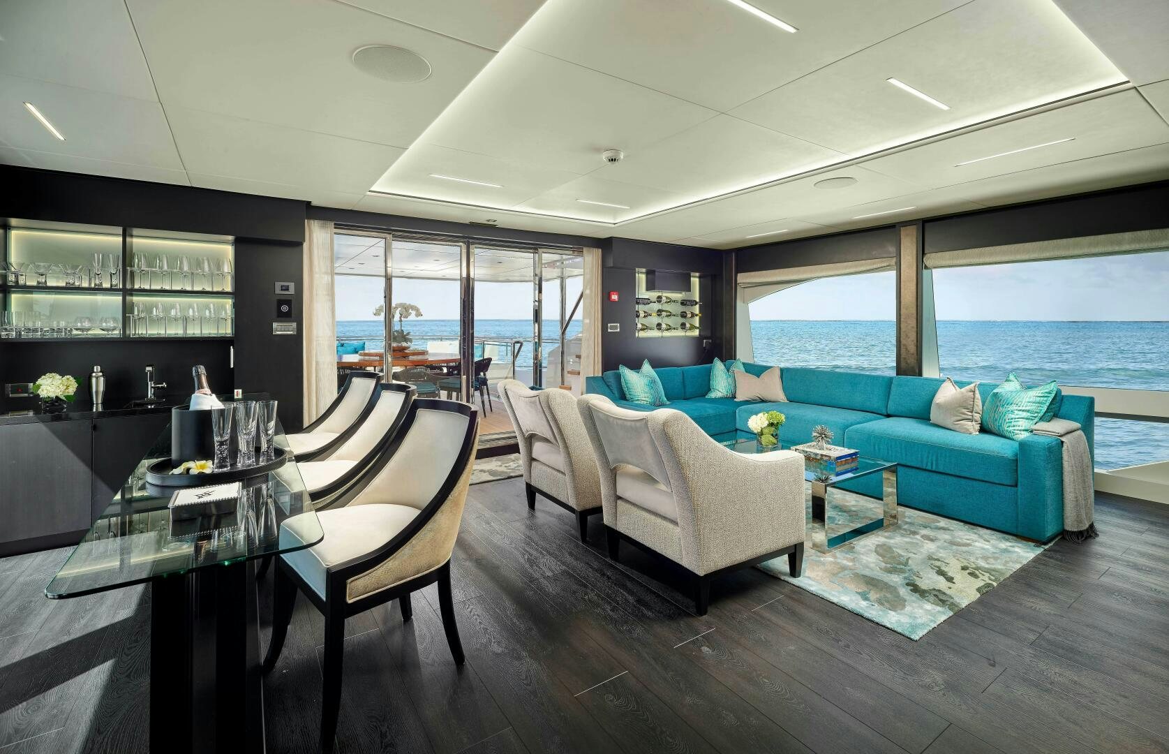 a living room with a large window aboard ROMEO FOXTROT Yacht for Sale
