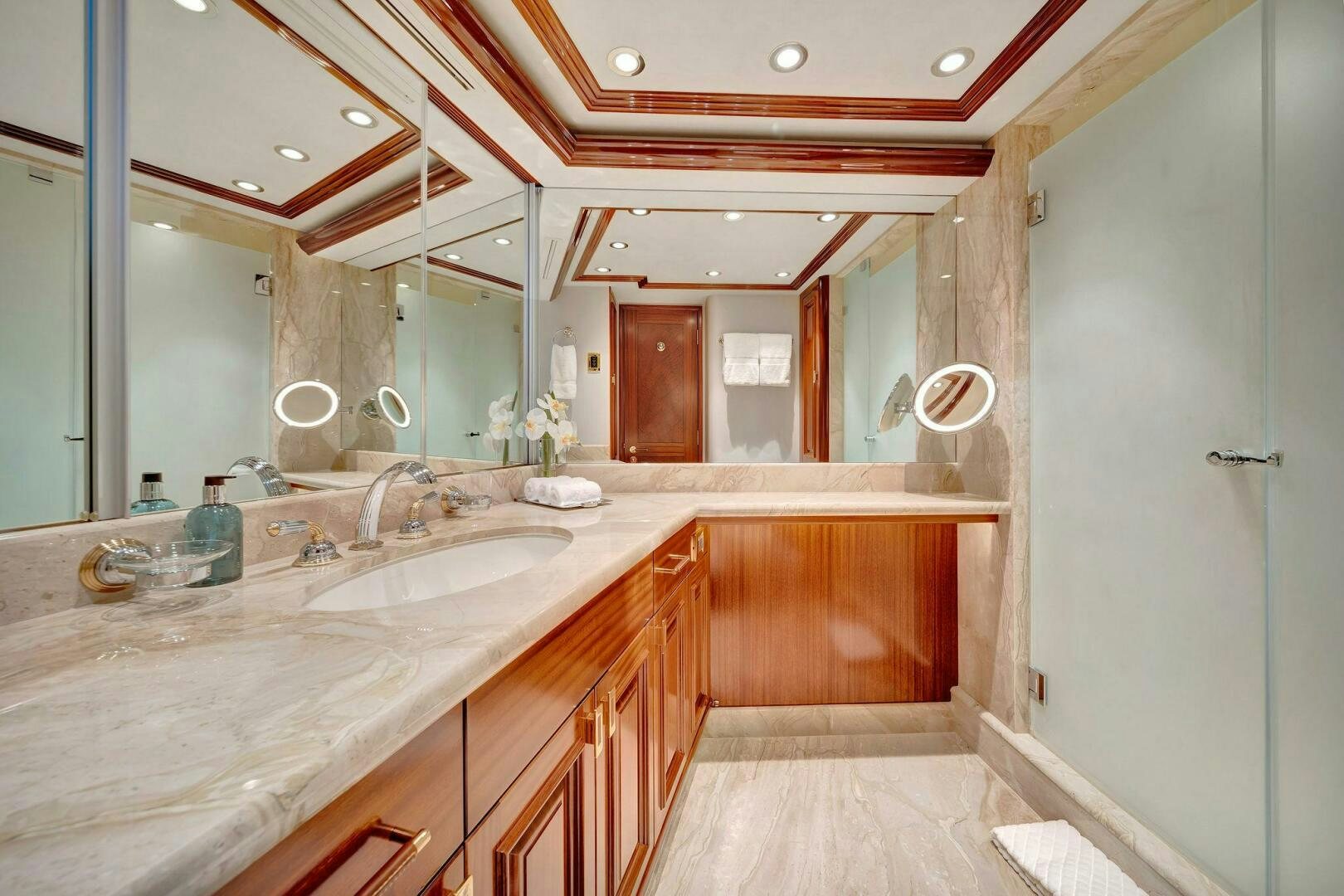 a bathroom with a countertop sink and cabinets aboard JEANNIETINI NAME RESERVED Yacht for Sale