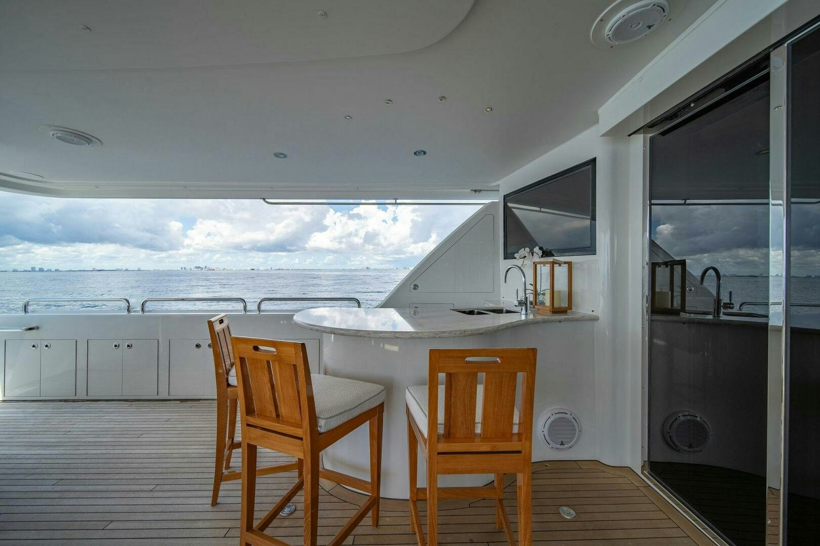 a kitchen with a table and chairs aboard JEANNIETINI NAME RESERVED Yacht for Sale