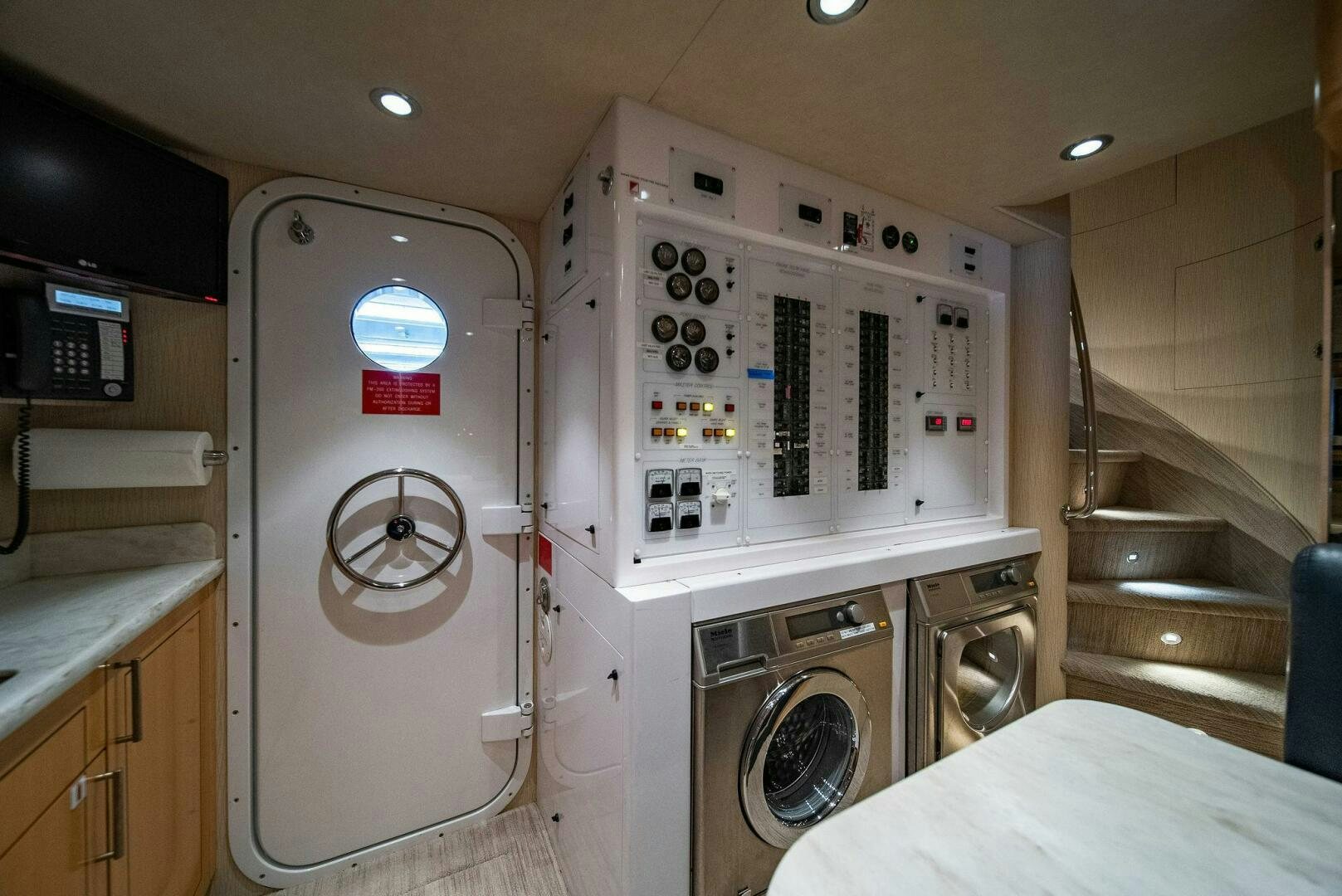a room with a washing machine and dryer aboard JEANNIETINI NAME RESERVED Yacht for Sale