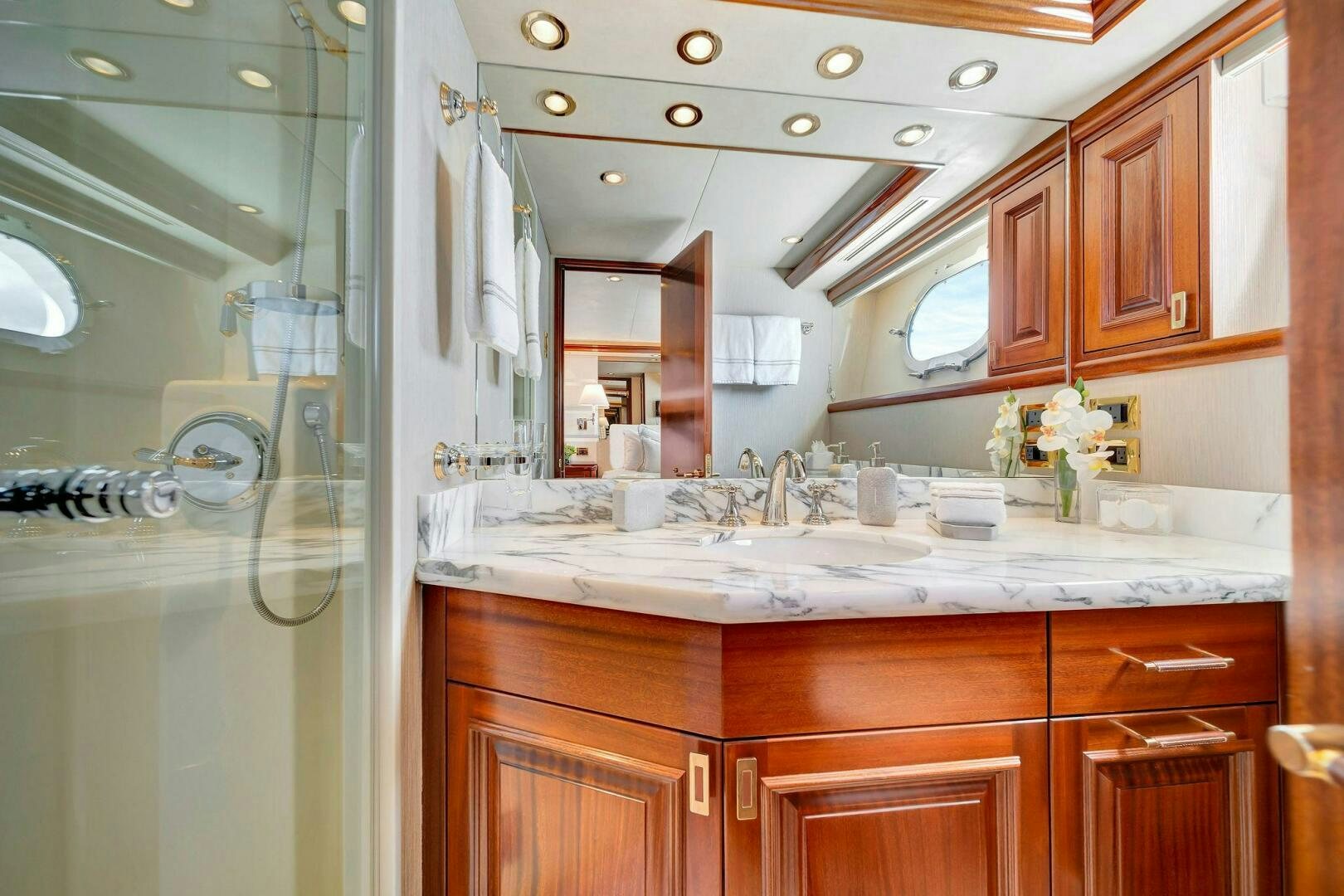 a bathroom with a glass shower aboard JEANNIETINI NAME RESERVED Yacht for Sale