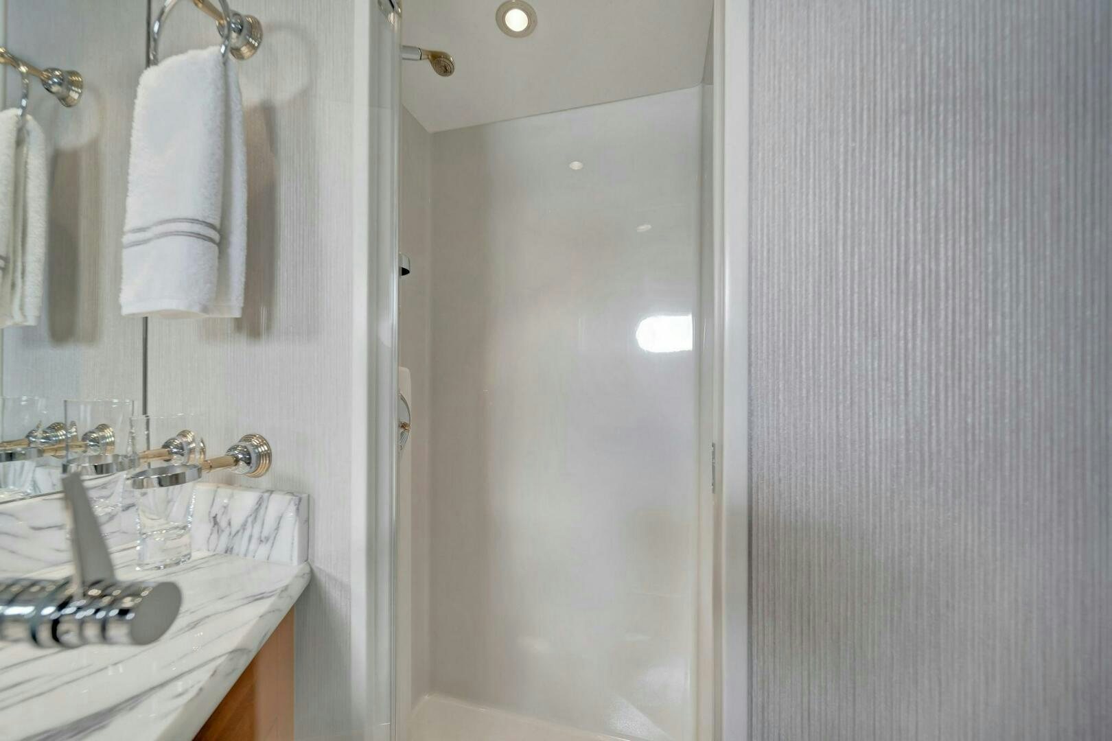 a bathroom with a sink and towels aboard JEANNIETINI NAME RESERVED Yacht for Sale