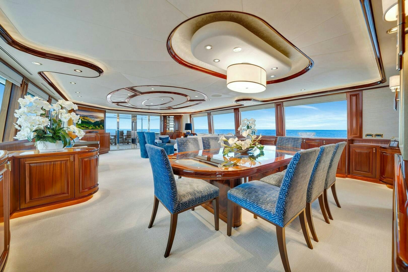 a large dining room with a table and chairs aboard JEANNIETINI NAME RESERVED Yacht for Sale