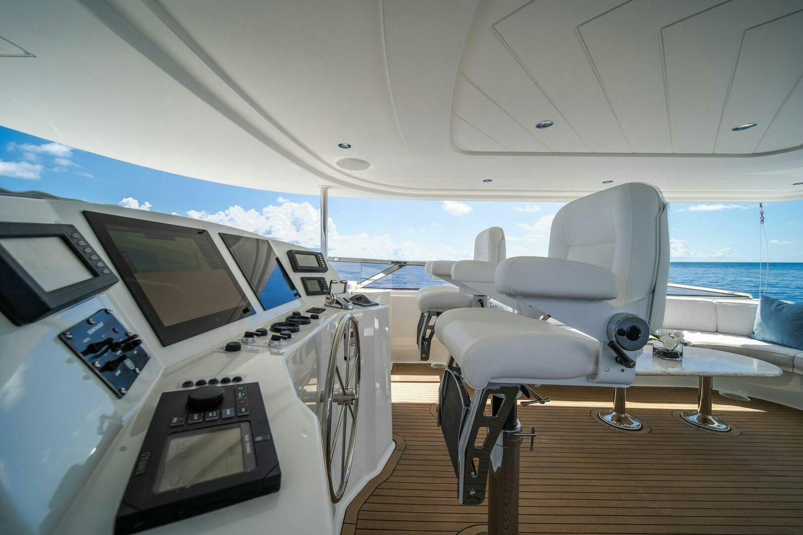 a room with a large window and a view of the ocean aboard JEANNIETINI NAME RESERVED Yacht for Sale