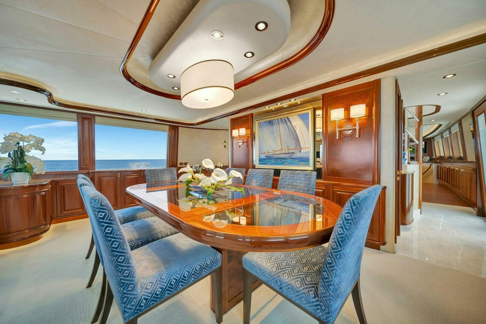 a large dining table in a living room aboard JEANNIETINI NAME RESERVED Yacht for Sale