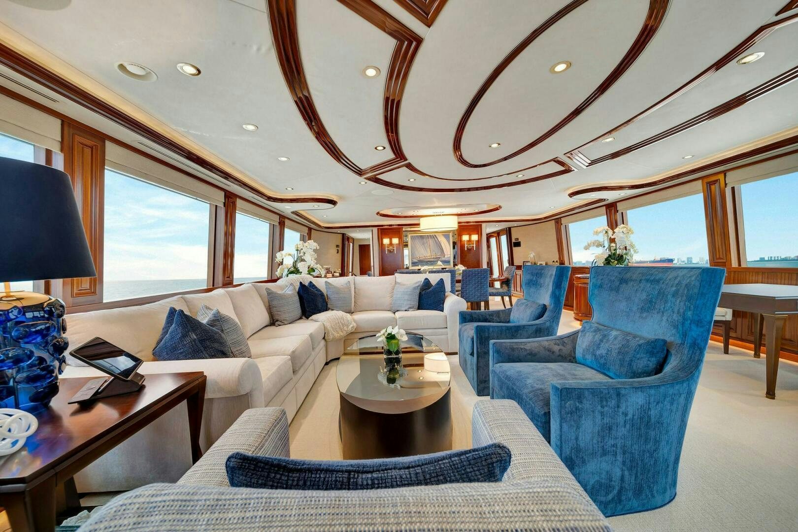 a living room with a large chandelier aboard JEANNIETINI NAME RESERVED Yacht for Sale
