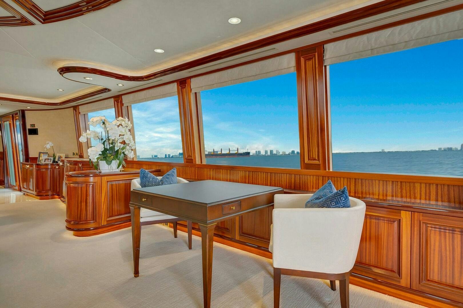 a room with a table and chairs aboard JEANNIETINI NAME RESERVED Yacht for Sale