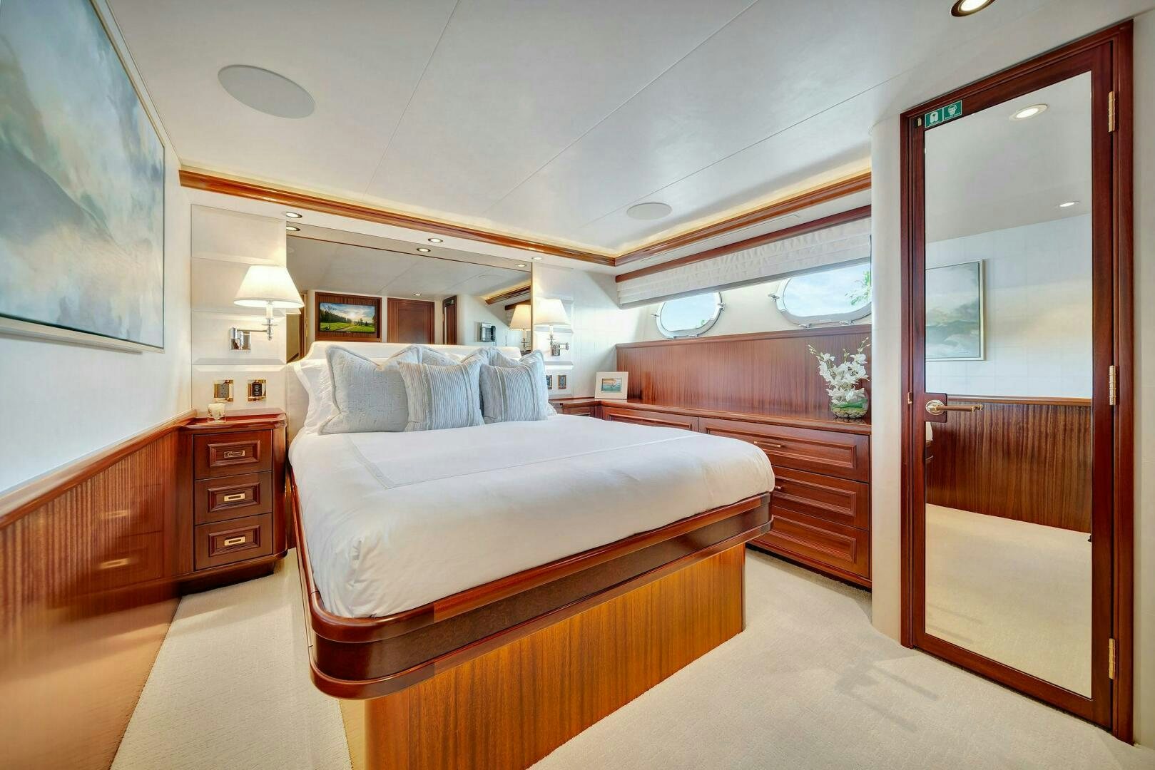 a room with a bed and a mirror aboard JEANNIETINI NAME RESERVED Yacht for Sale