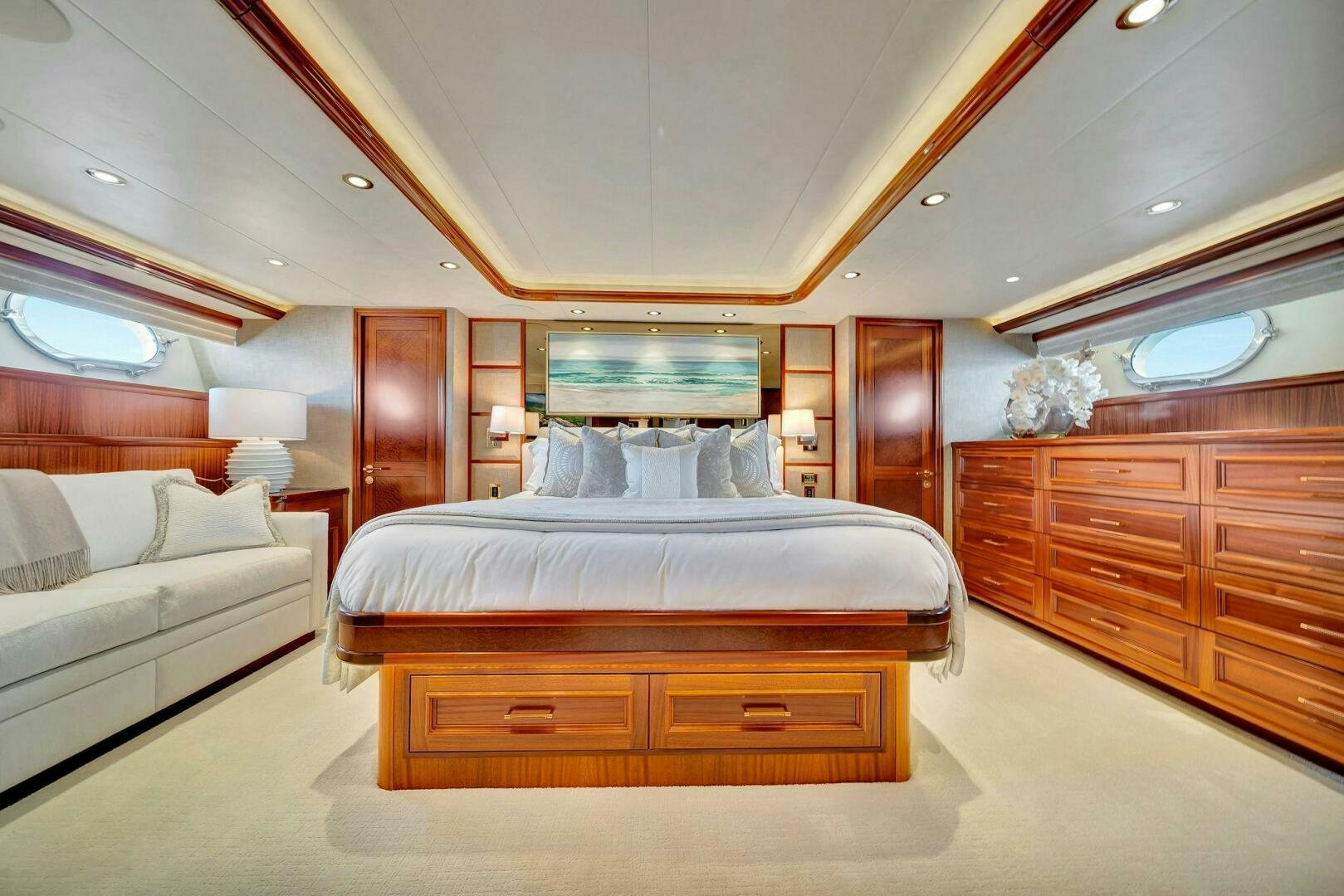a bedroom with a bed and a dresser aboard JEANNIETINI NAME RESERVED Yacht for Sale