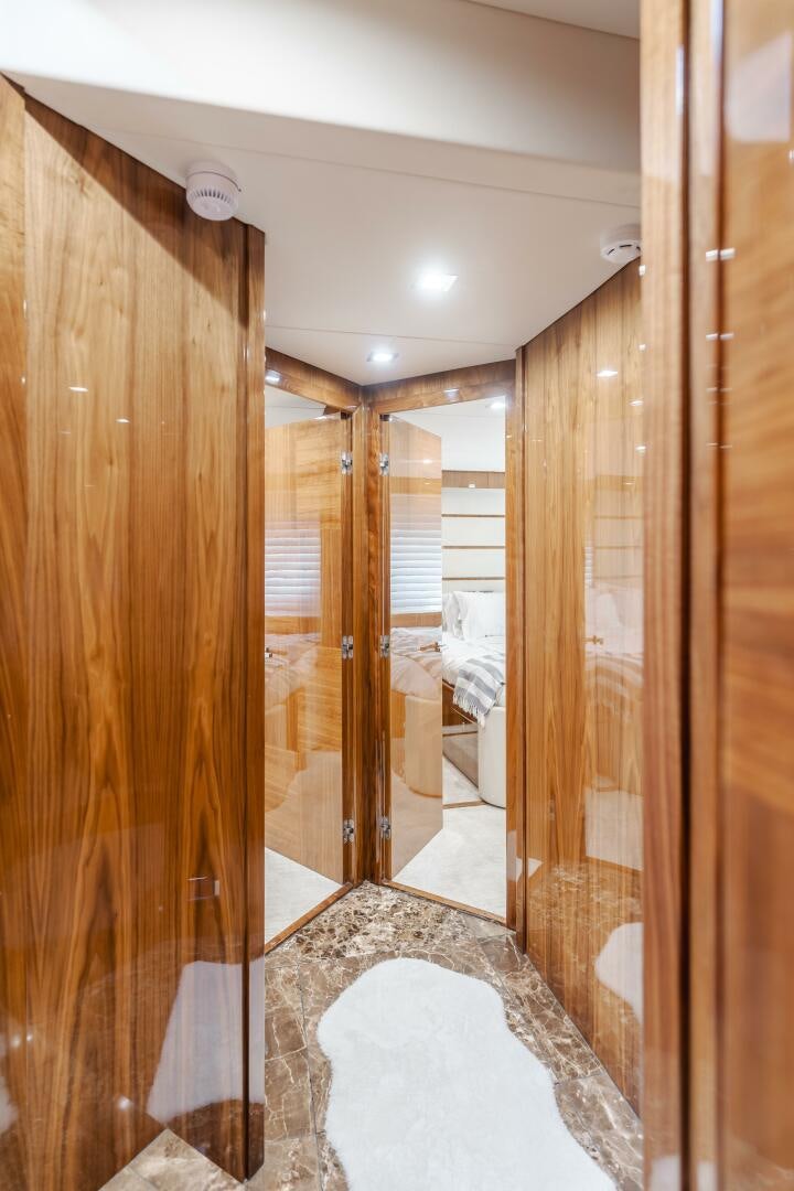 a bathroom with a shower and a sink aboard INDECENT PROPOSAL IV Yacht for Sale