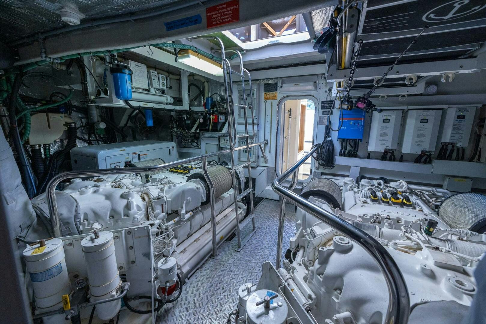 a room with machinery aboard INDECENT PROPOSAL IV Yacht for Sale