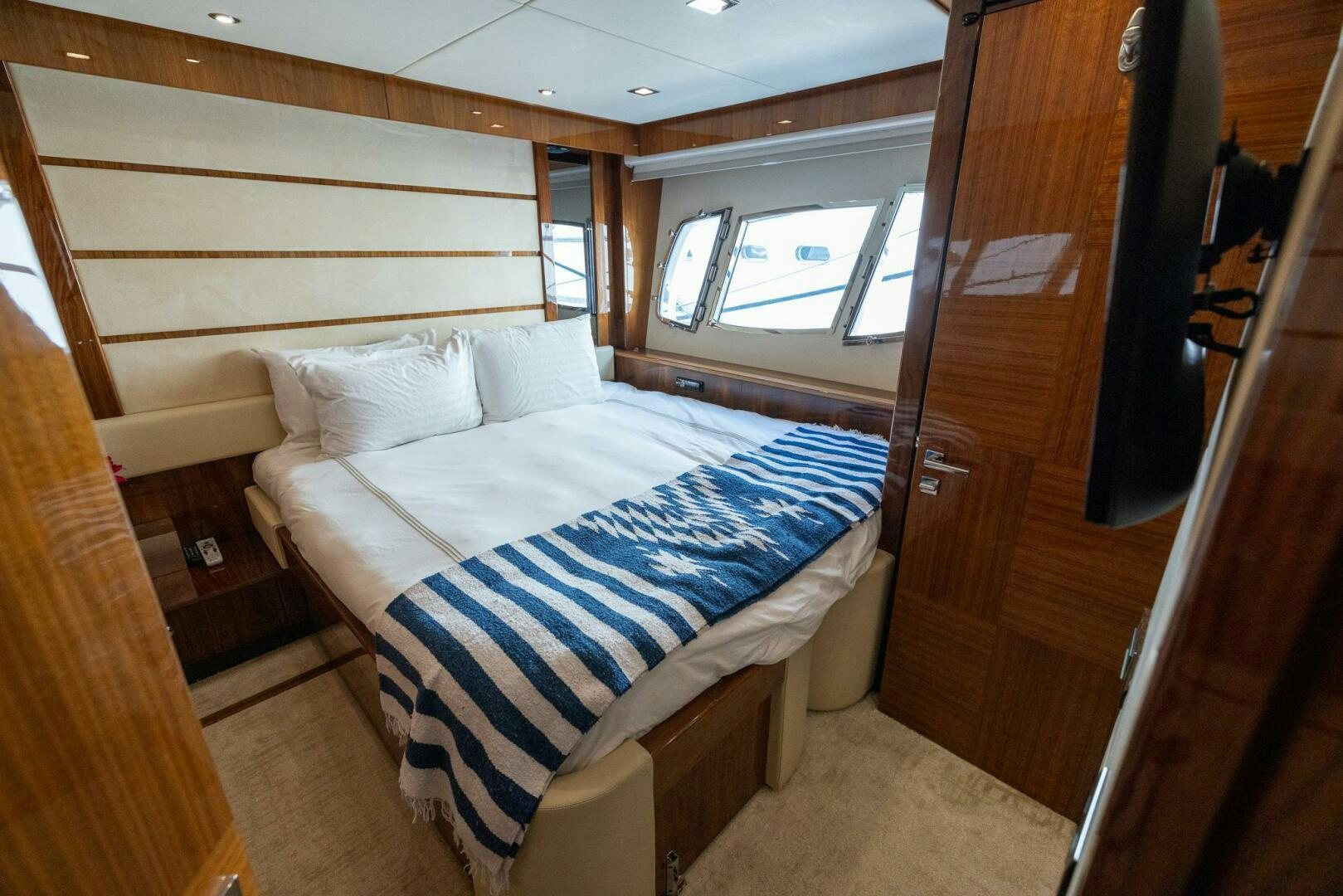 a bed in a room aboard INDECENT PROPOSAL IV Yacht for Sale