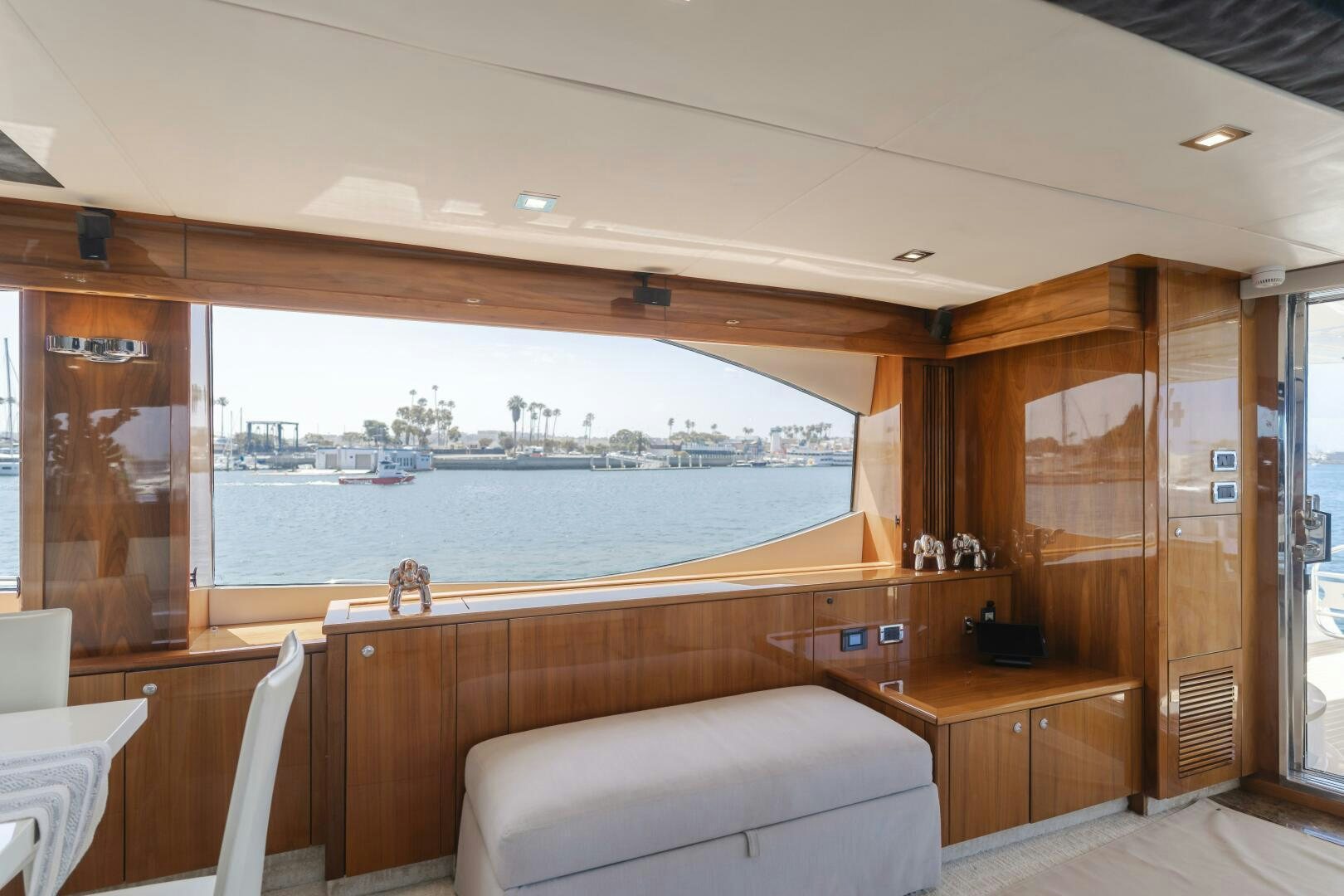 a room with a view of a city and water aboard INDECENT PROPOSAL IV Yacht for Sale