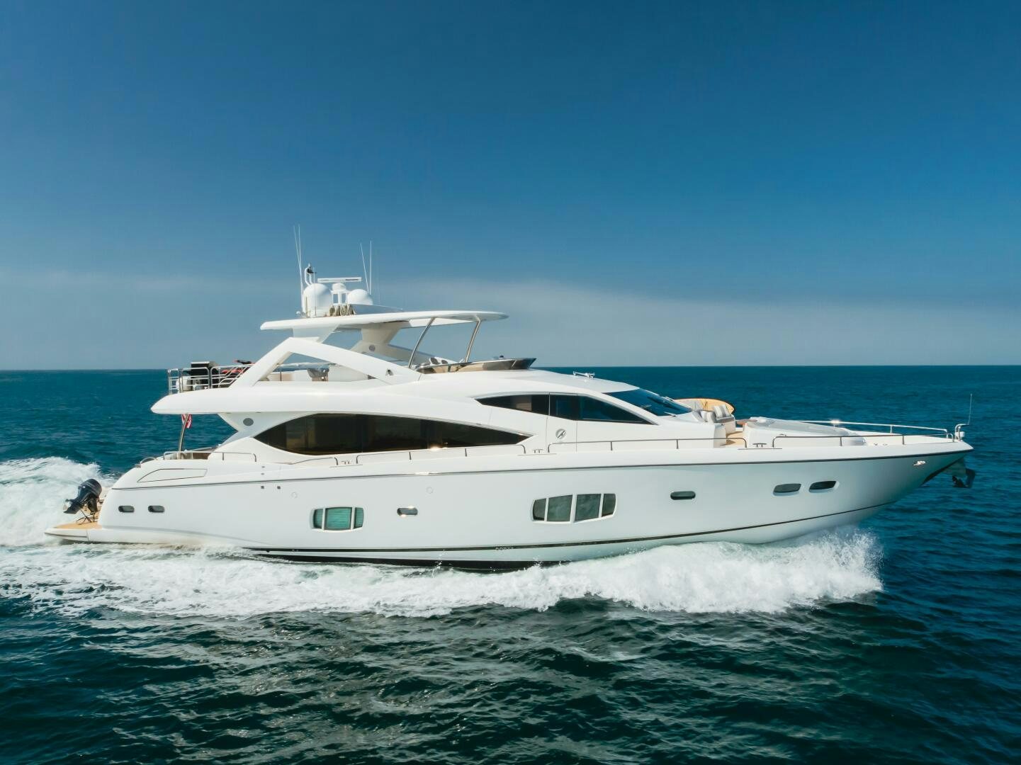 a white yacht on the water aboard INDECENT PROPOSAL IV Yacht for Sale