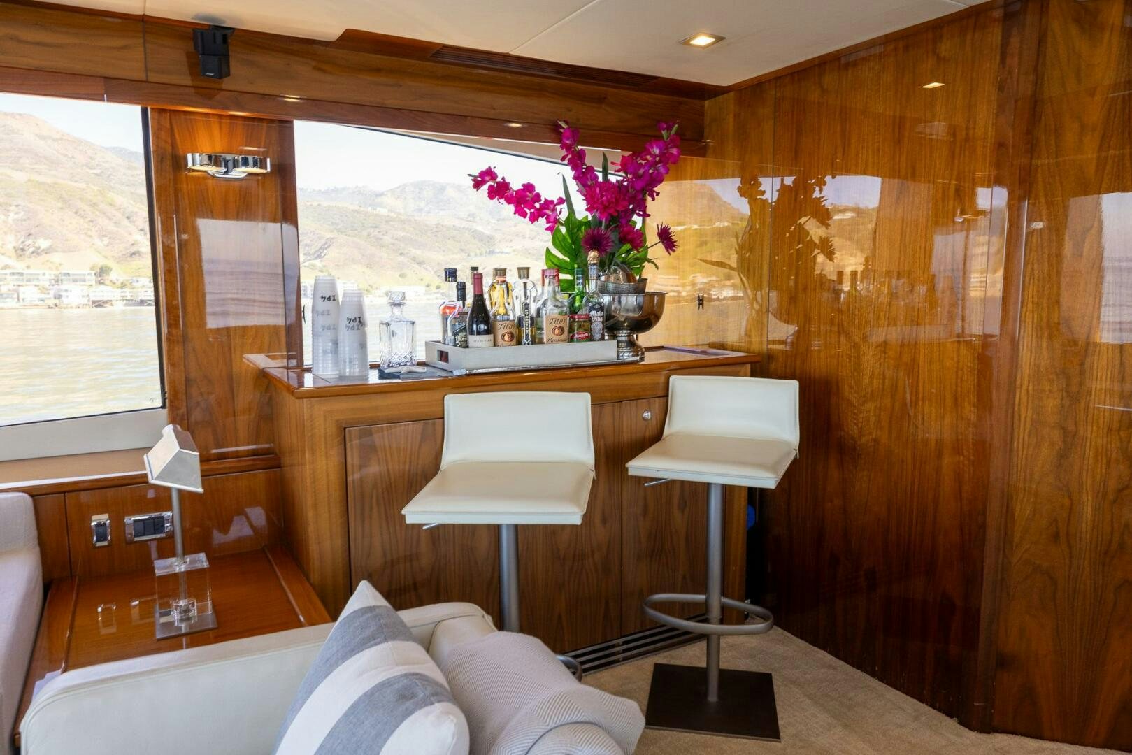 a room with a table and chairs aboard INDECENT PROPOSAL IV Yacht for Sale
