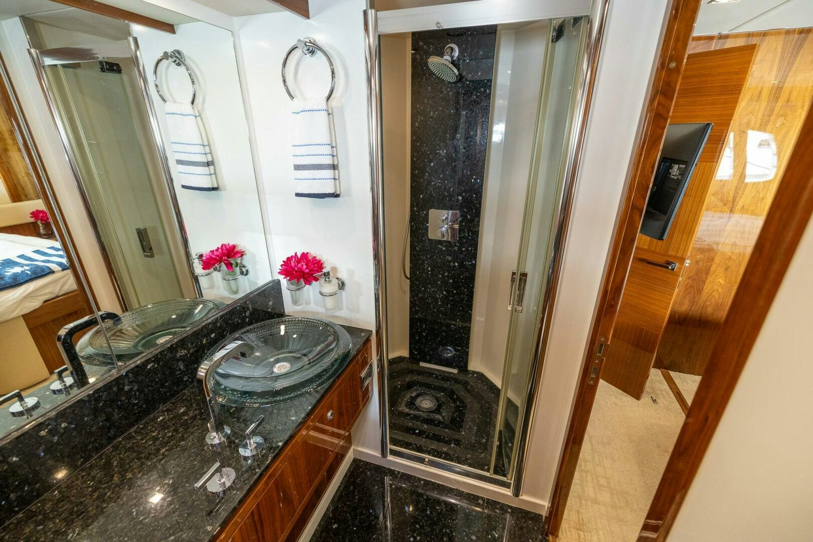 a bathroom with a marble counter top aboard INDECENT PROPOSAL IV Yacht for Sale