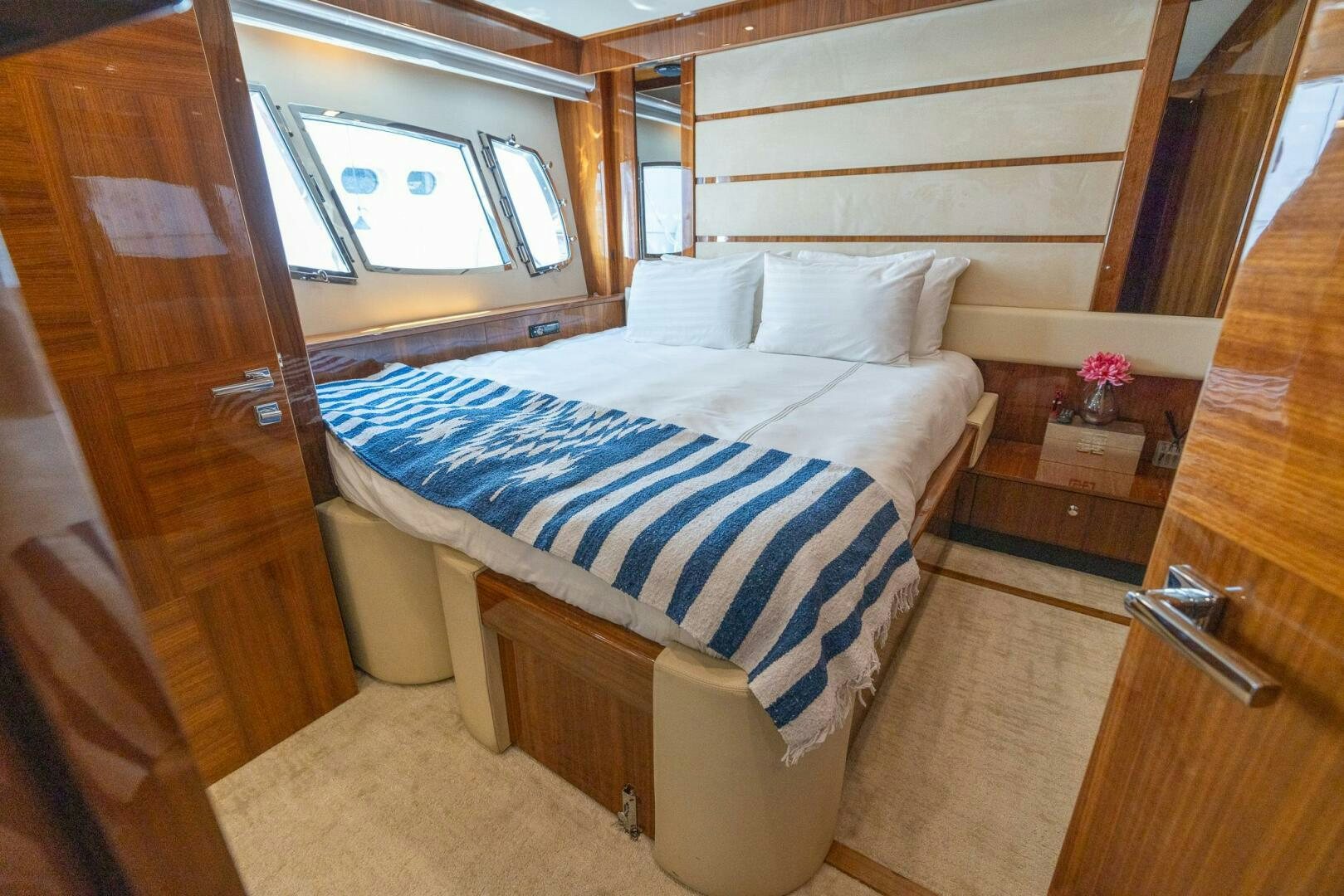 a bed in a room aboard INDECENT PROPOSAL IV Yacht for Sale