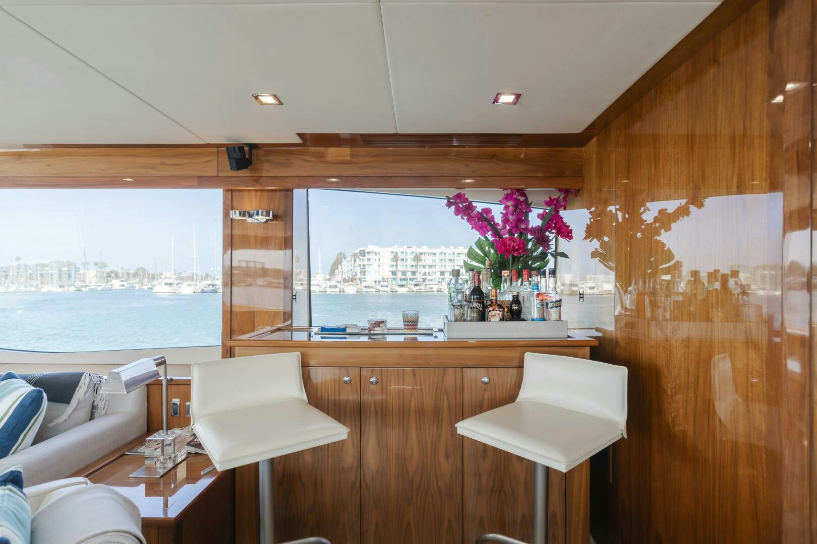 a room with a table and chairs aboard INDECENT PROPOSAL IV Yacht for Sale