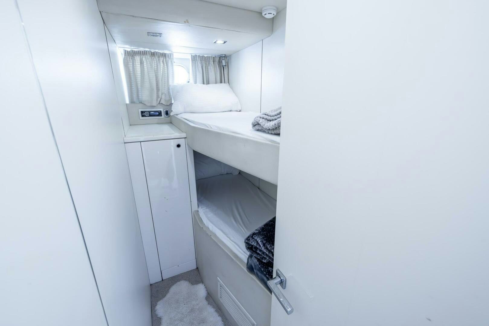 a room with white cabinets aboard INDECENT PROPOSAL IV Yacht for Sale
