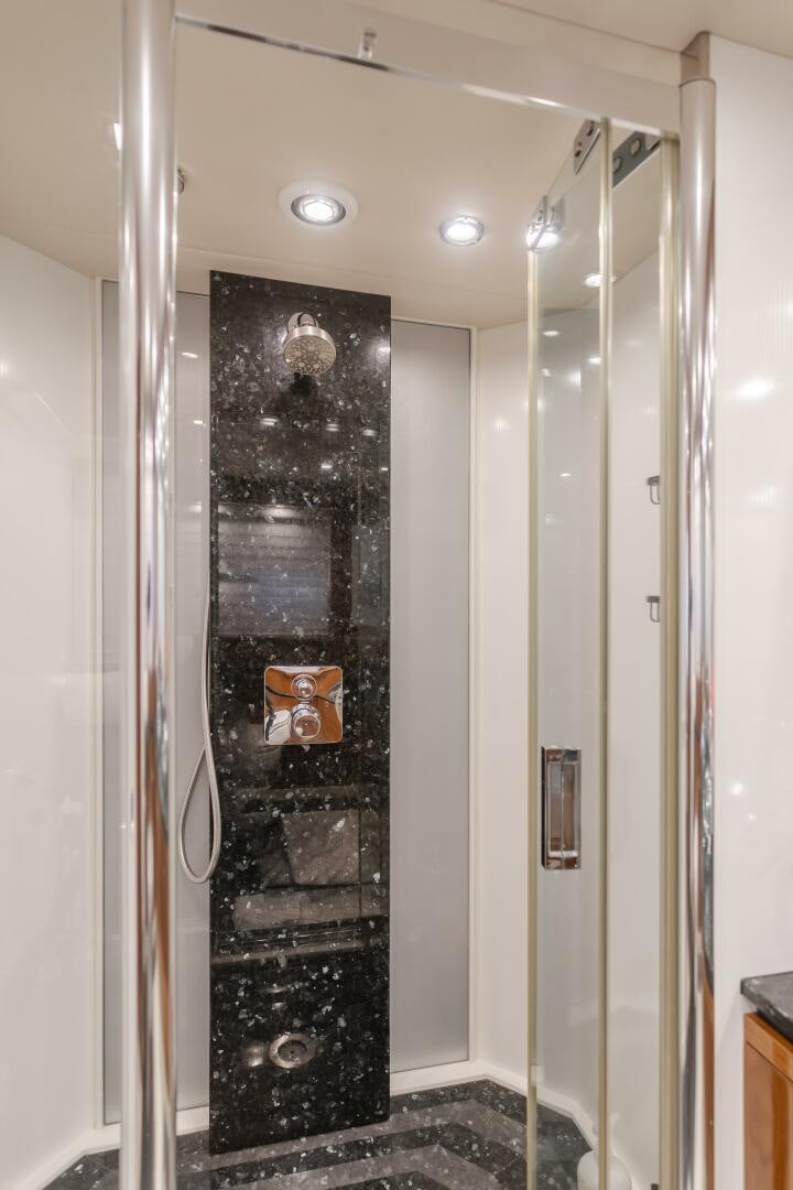 a black door with a black door aboard INDECENT PROPOSAL IV Yacht for Sale