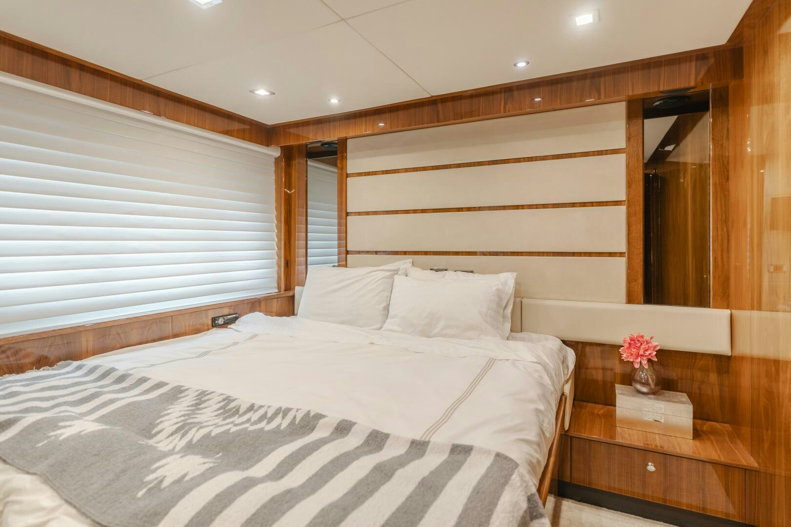 a bed with white sheets aboard INDECENT PROPOSAL IV Yacht for Sale
