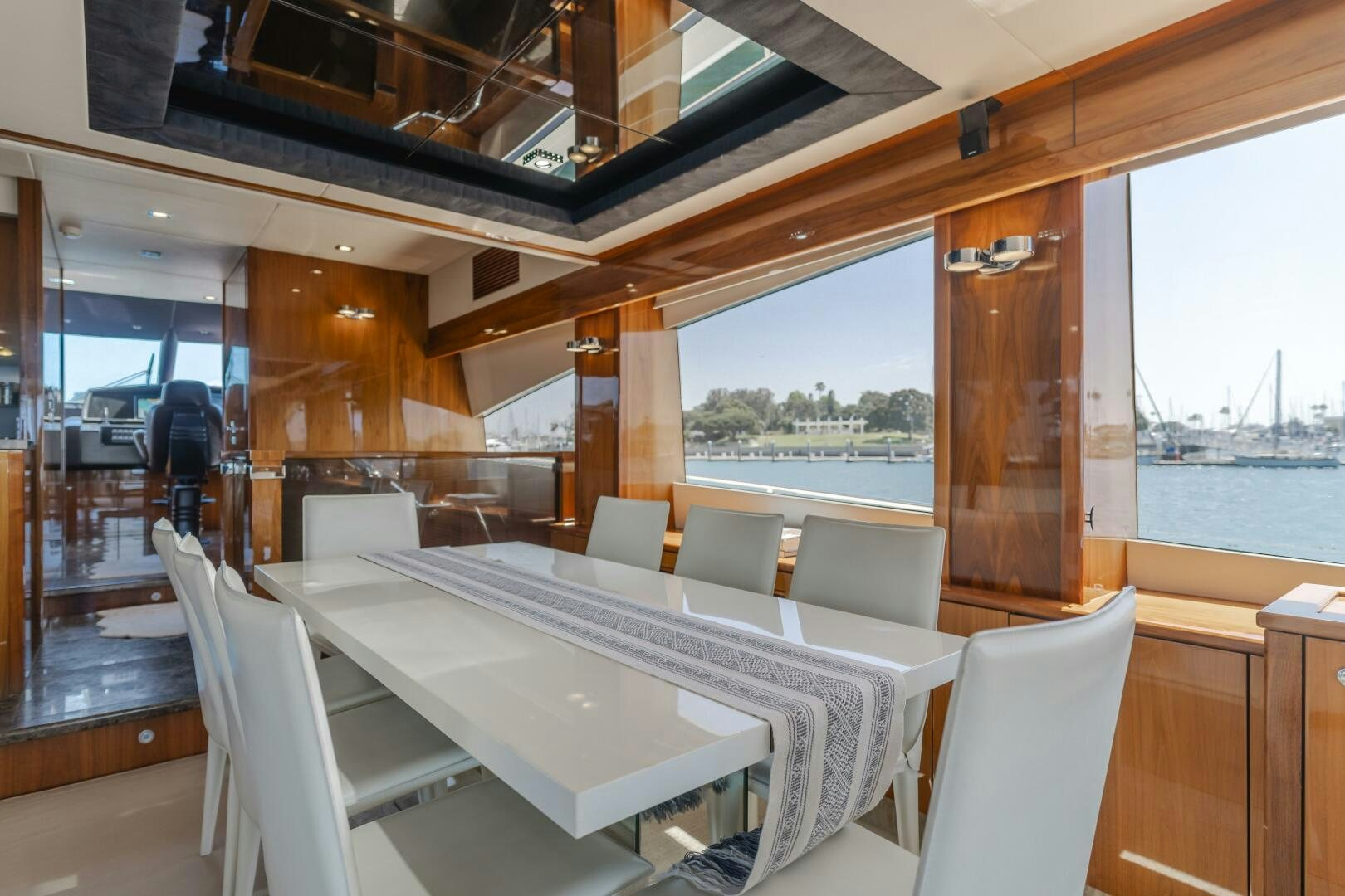 a room with a table and chairs aboard INDECENT PROPOSAL IV Yacht for Sale