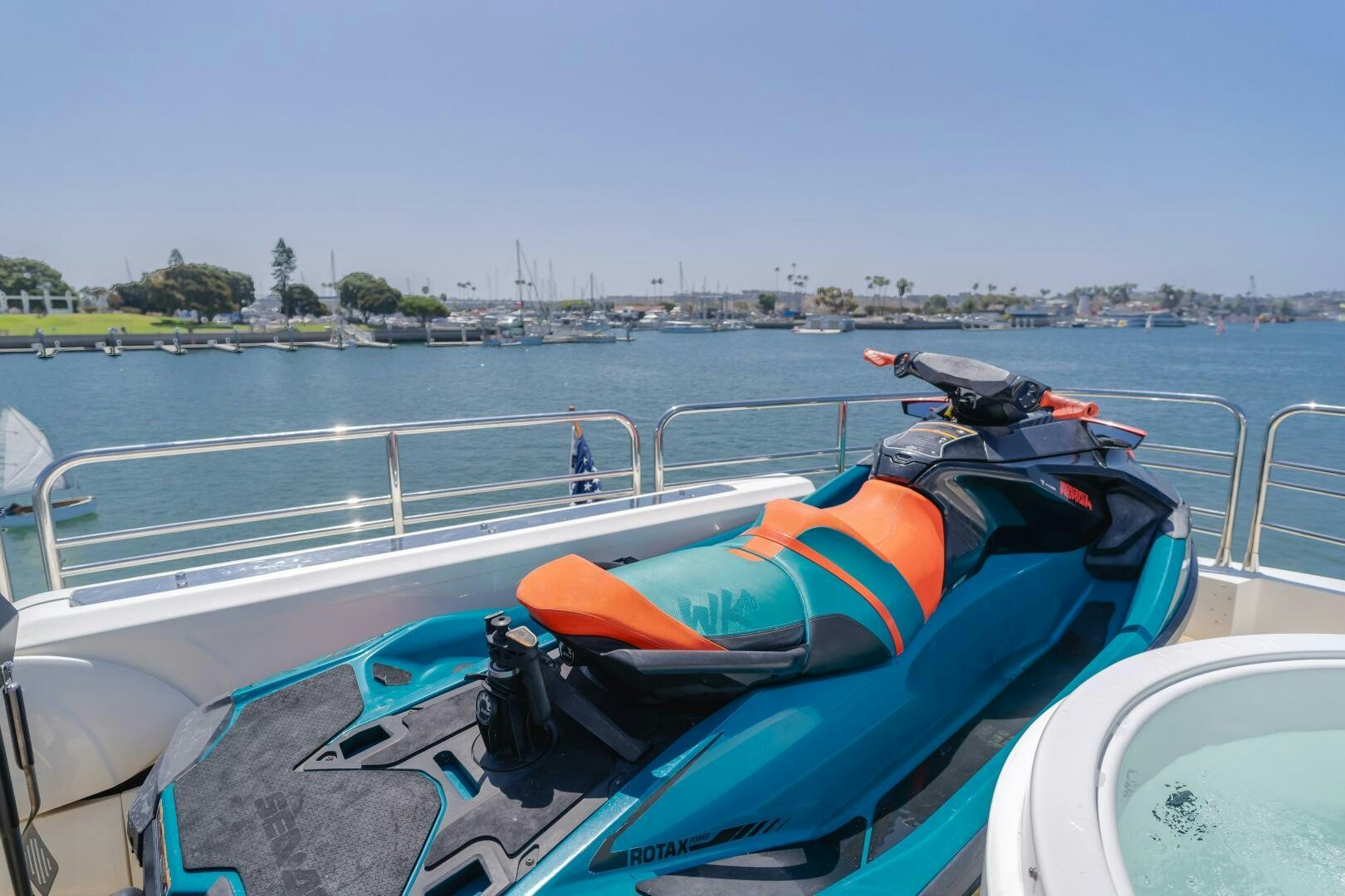a boat with a blue and orange kayak on it aboard INDECENT PROPOSAL IV Yacht for Sale