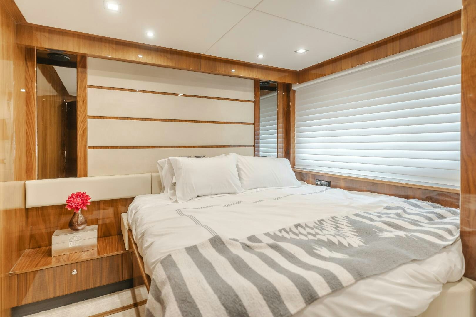 a bed with white sheets aboard INDECENT PROPOSAL IV Yacht for Sale