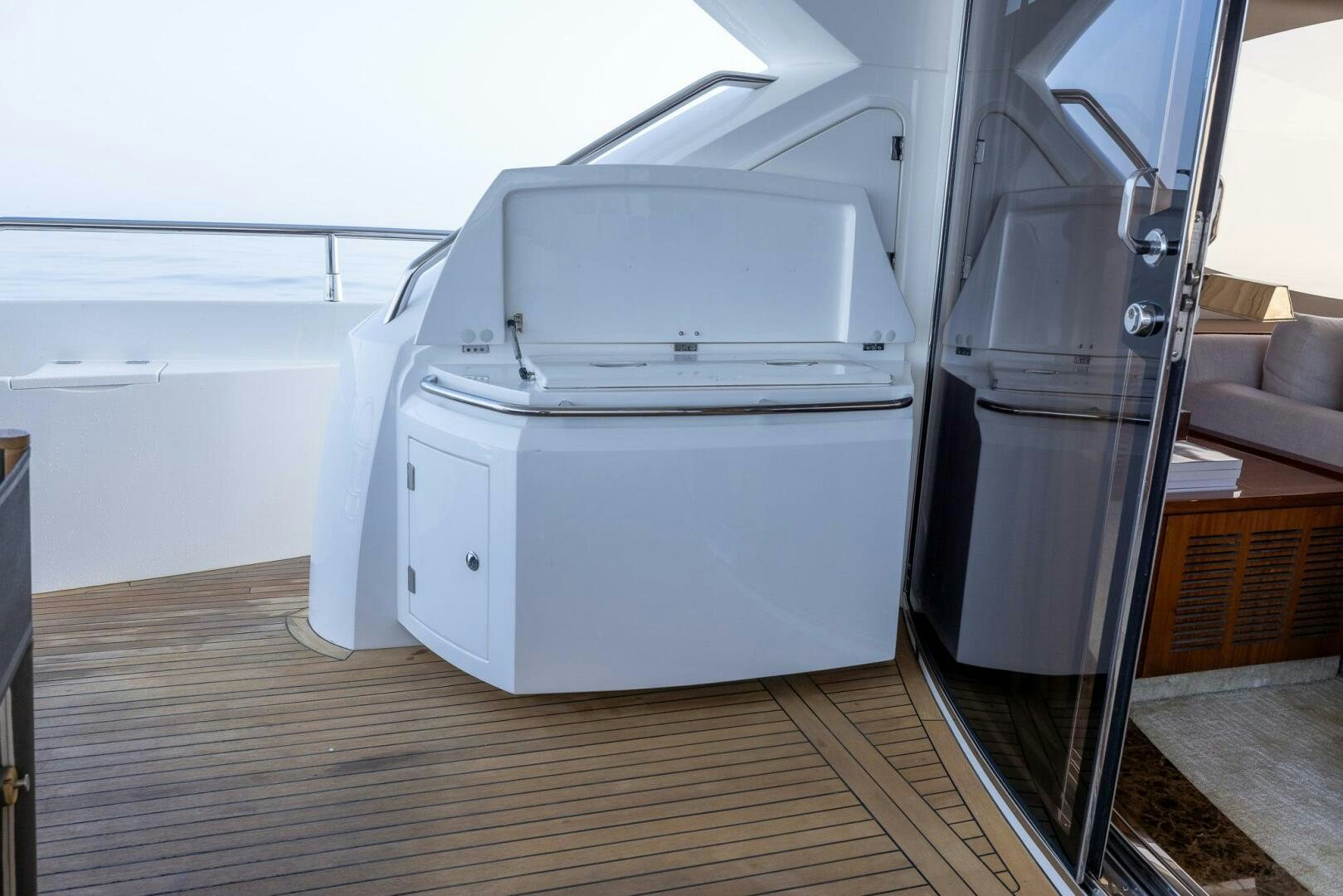 a white rectangular object on a wooden surface aboard INDECENT PROPOSAL IV Yacht for Sale