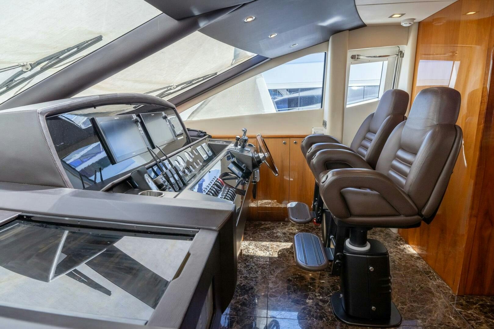 inside of a car aboard INDECENT PROPOSAL IV Yacht for Sale