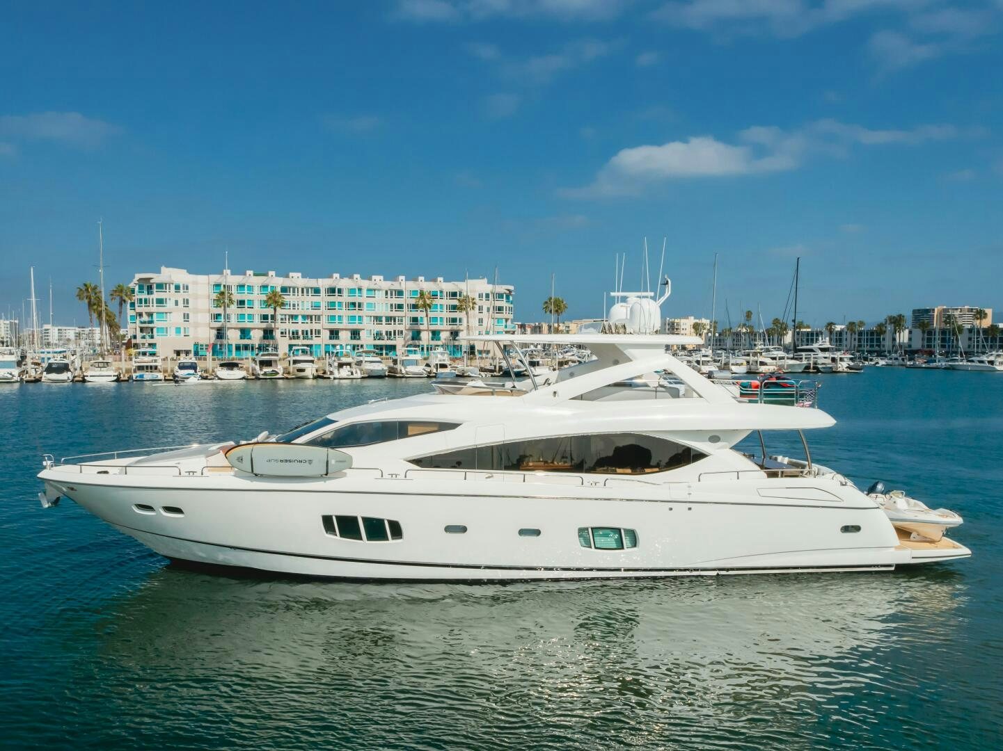 a white yacht in the water aboard INDECENT PROPOSAL IV Yacht for Sale