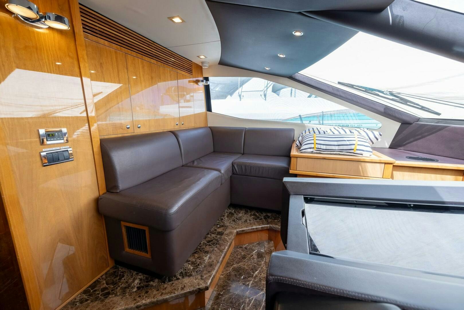 inside of a car aboard INDECENT PROPOSAL IV Yacht for Sale