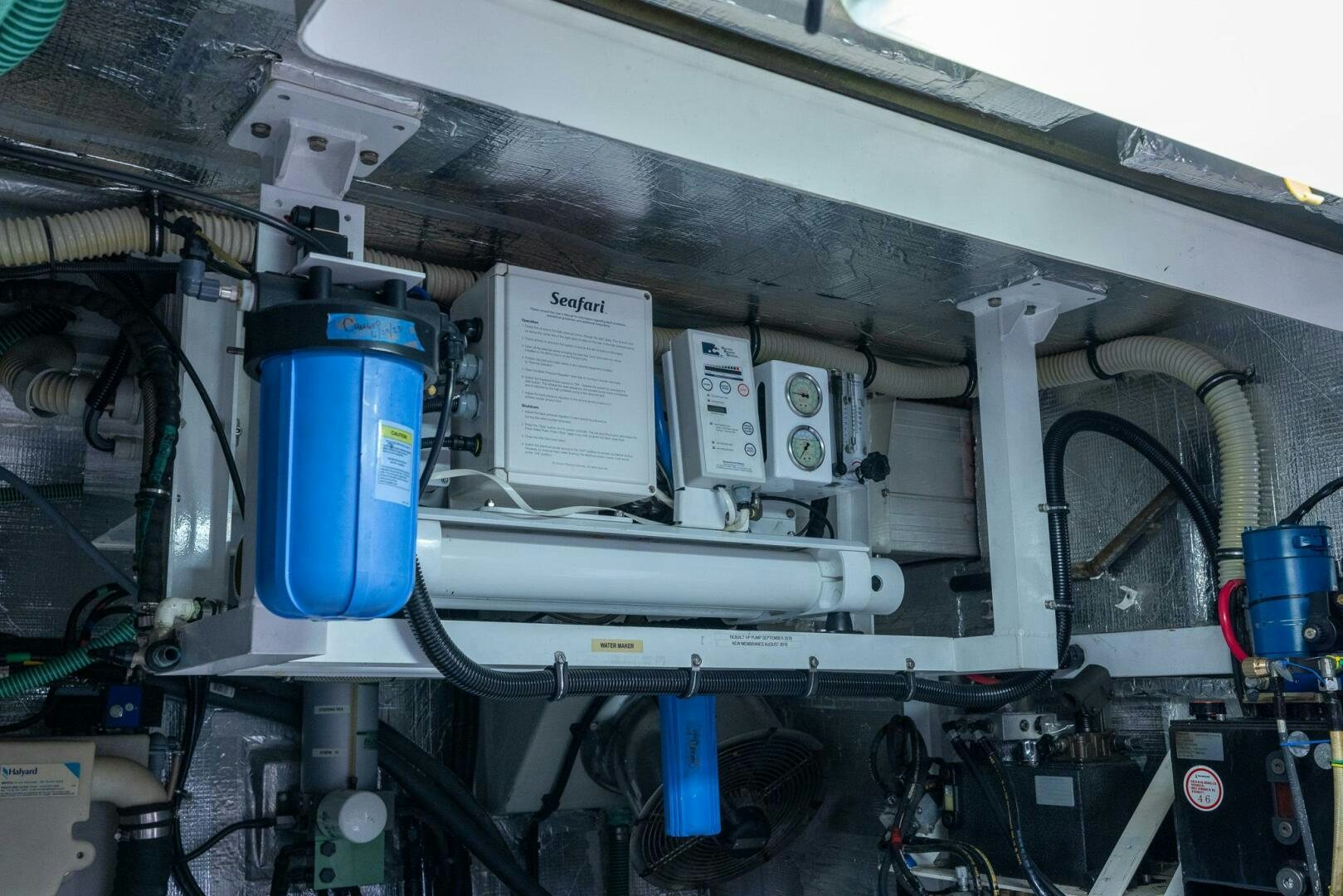 a machine with a blue container aboard INDECENT PROPOSAL IV Yacht for Sale