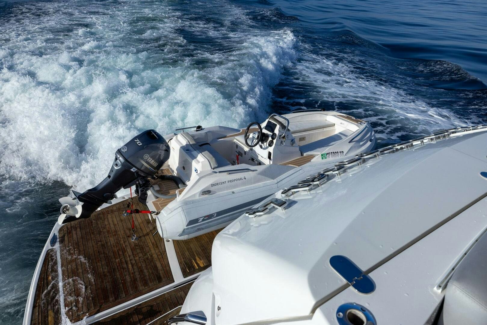 a boat with a motor aboard INDECENT PROPOSAL IV Yacht for Sale