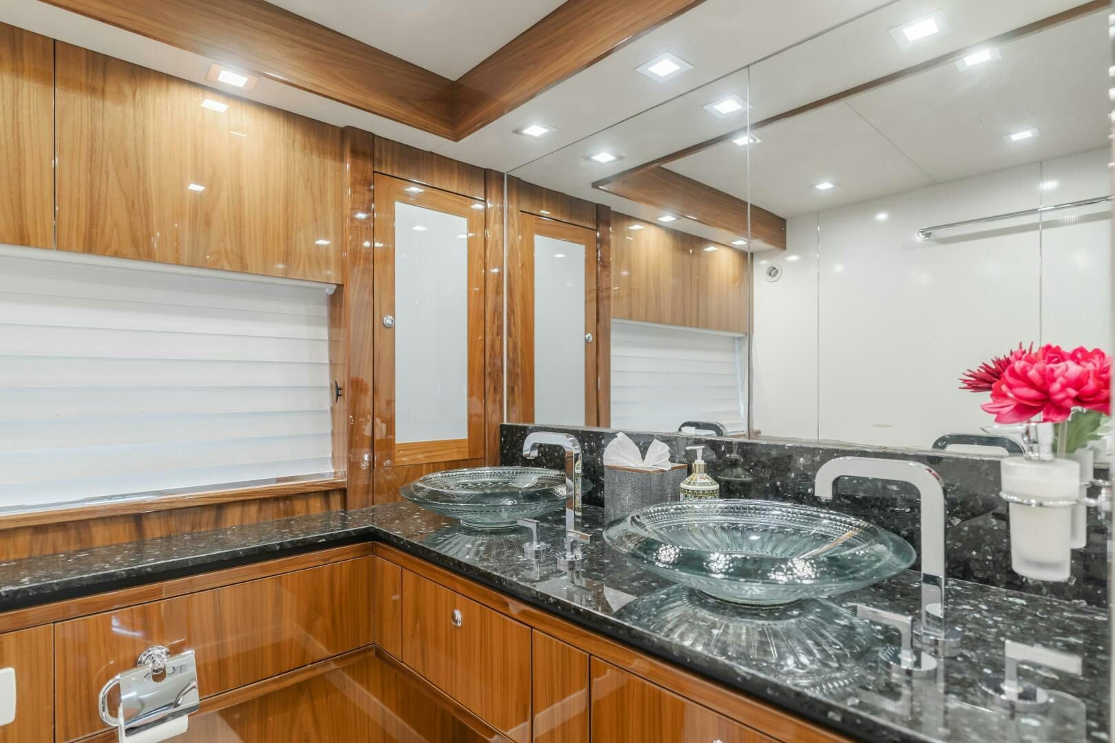 a kitchen with a marble counter top aboard INDECENT PROPOSAL IV Yacht for Sale
