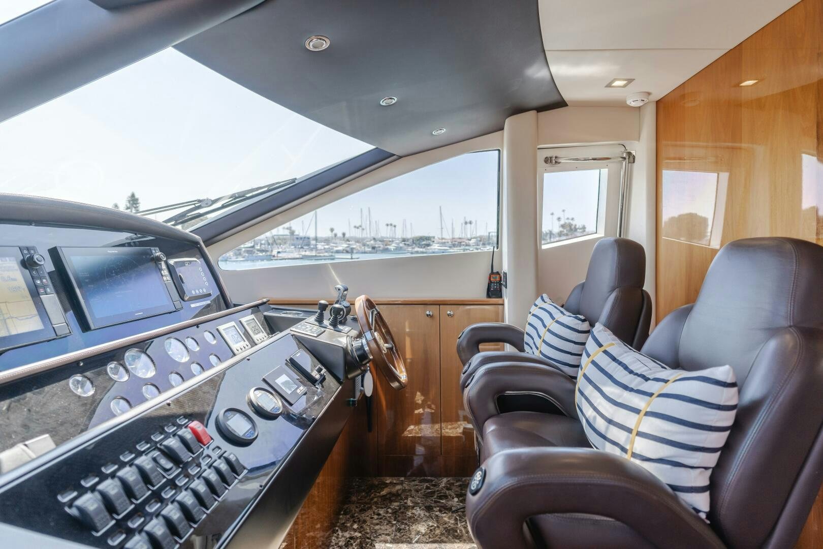 inside of a vehicle with a view of the water and the deck aboard INDECENT PROPOSAL IV Yacht for Sale