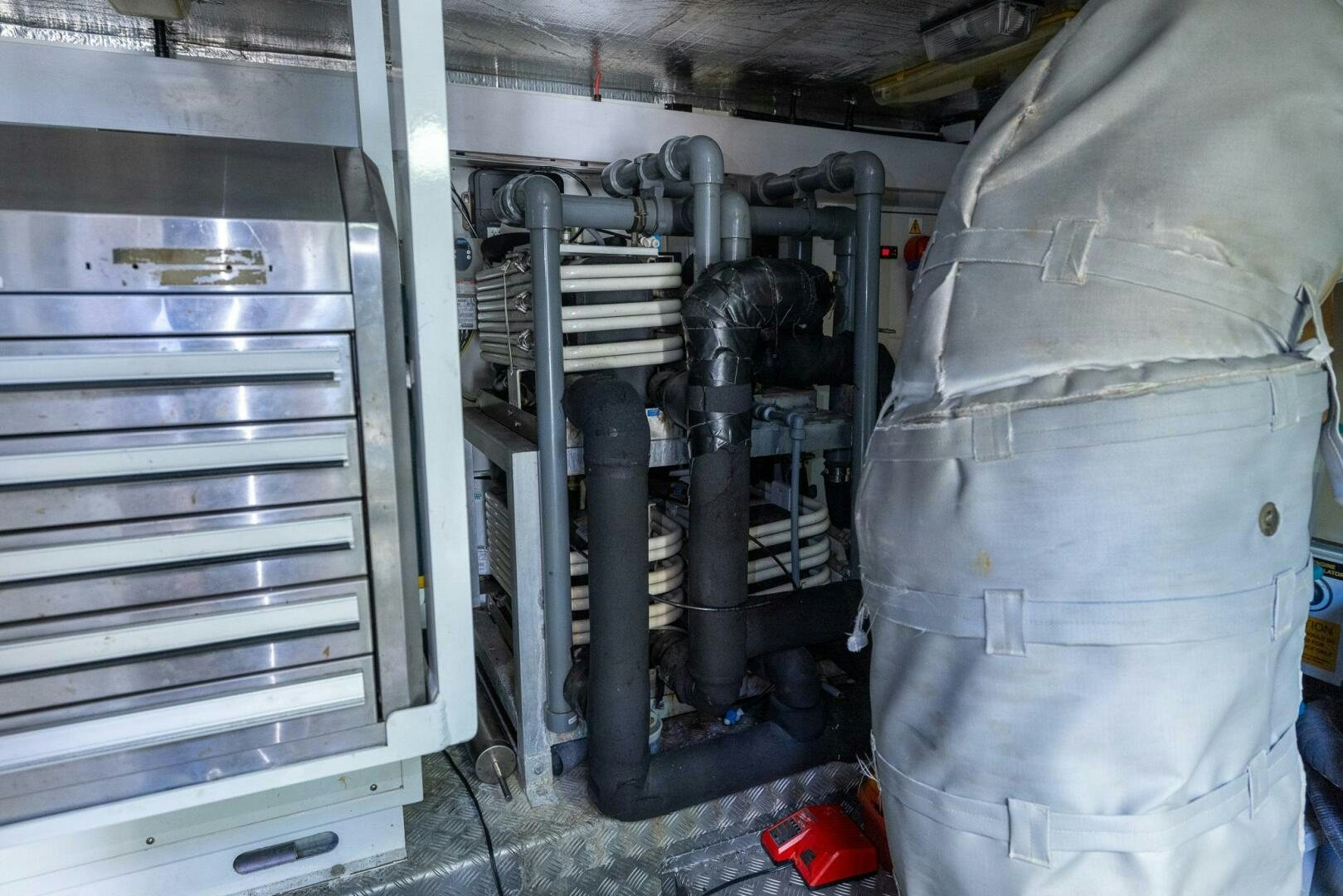 a car with a large metal cylinder aboard INDECENT PROPOSAL IV Yacht for Sale