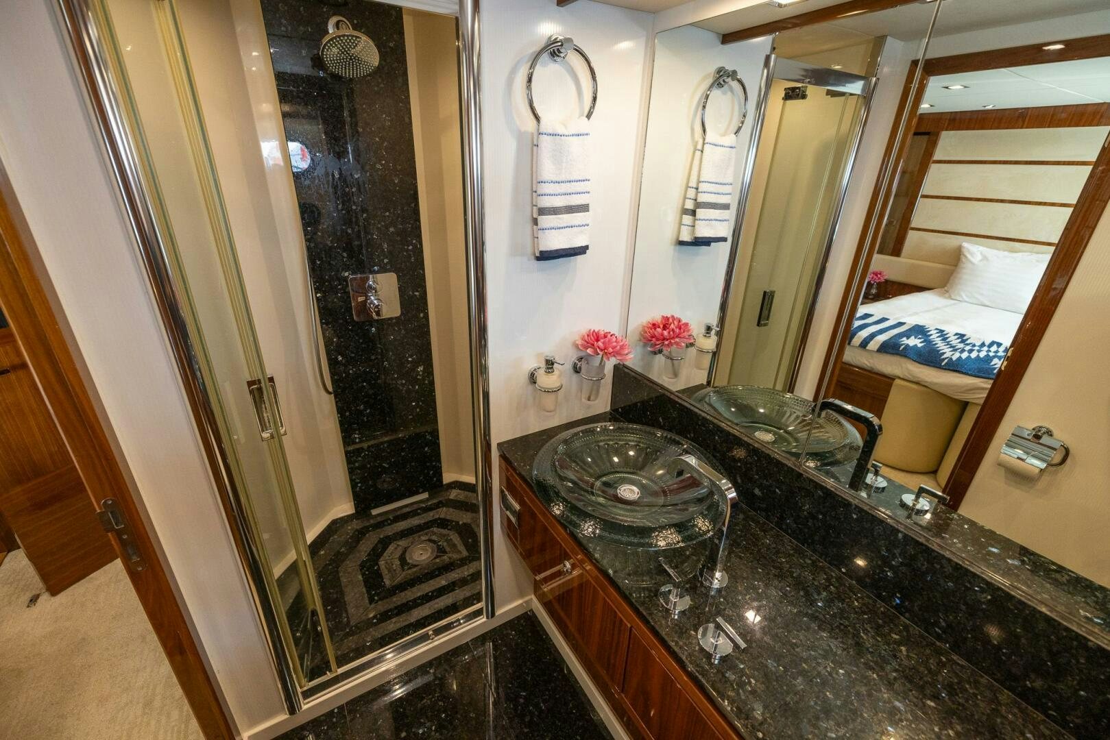 a bathroom with a marble counter top aboard INDECENT PROPOSAL IV Yacht for Sale