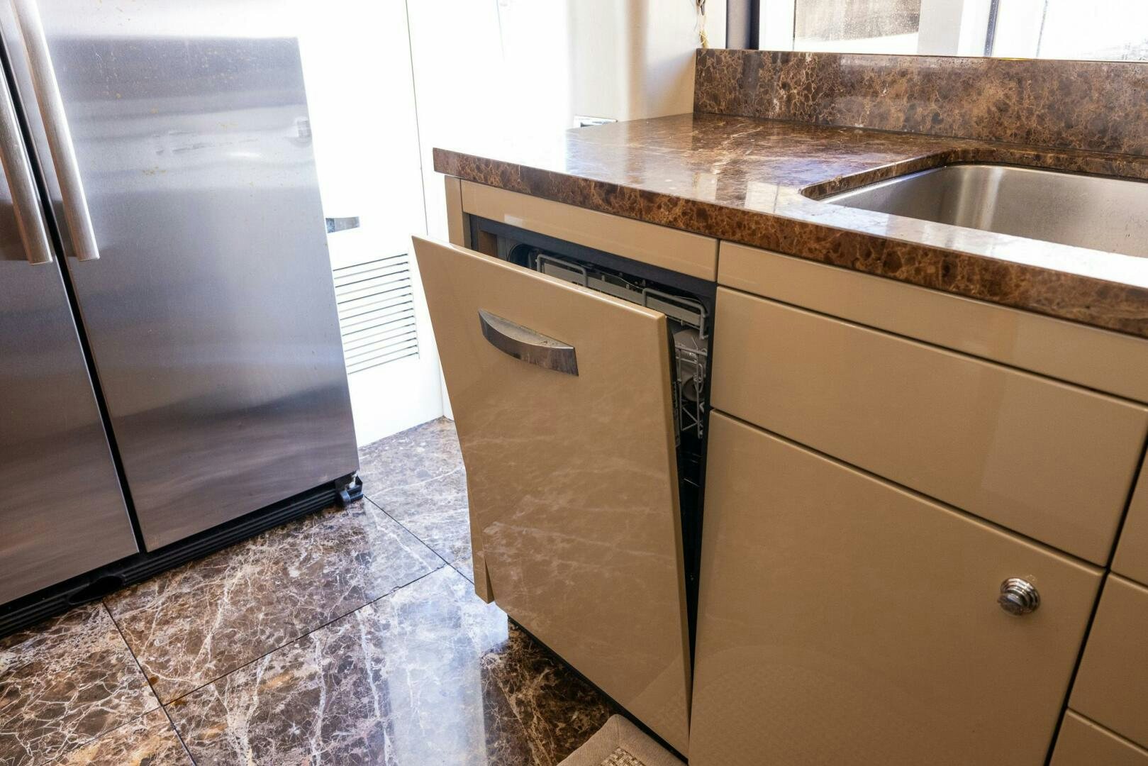 a kitchen with stainless steel appliances aboard INDECENT PROPOSAL IV Yacht for Sale