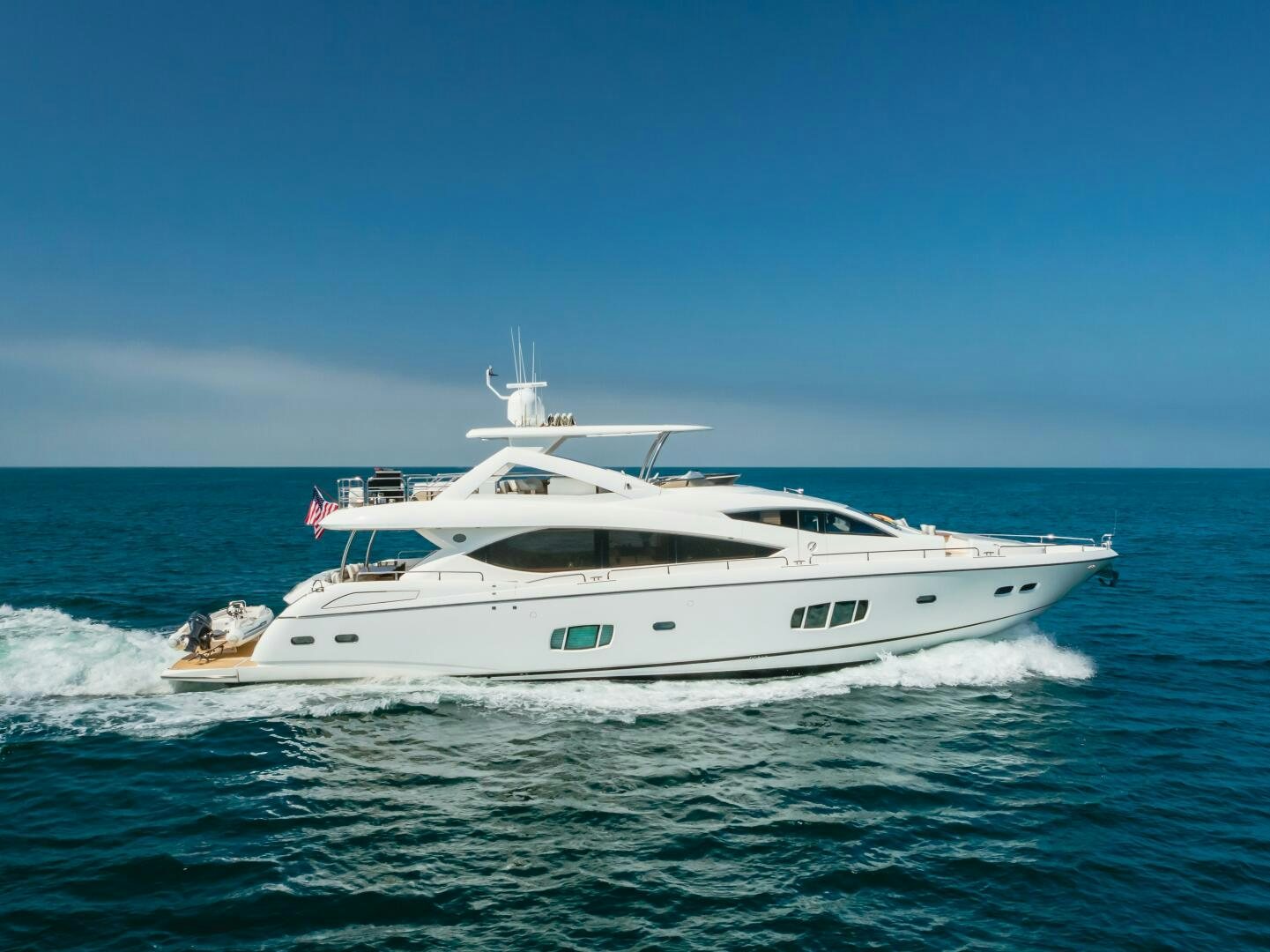 a white yacht on the water aboard INDECENT PROPOSAL IV Yacht for Sale