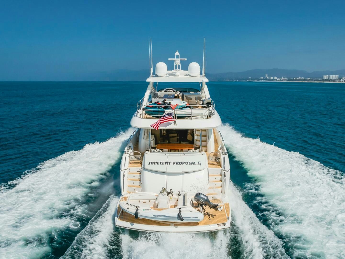 a boat on the water aboard INDECENT PROPOSAL IV Yacht for Sale