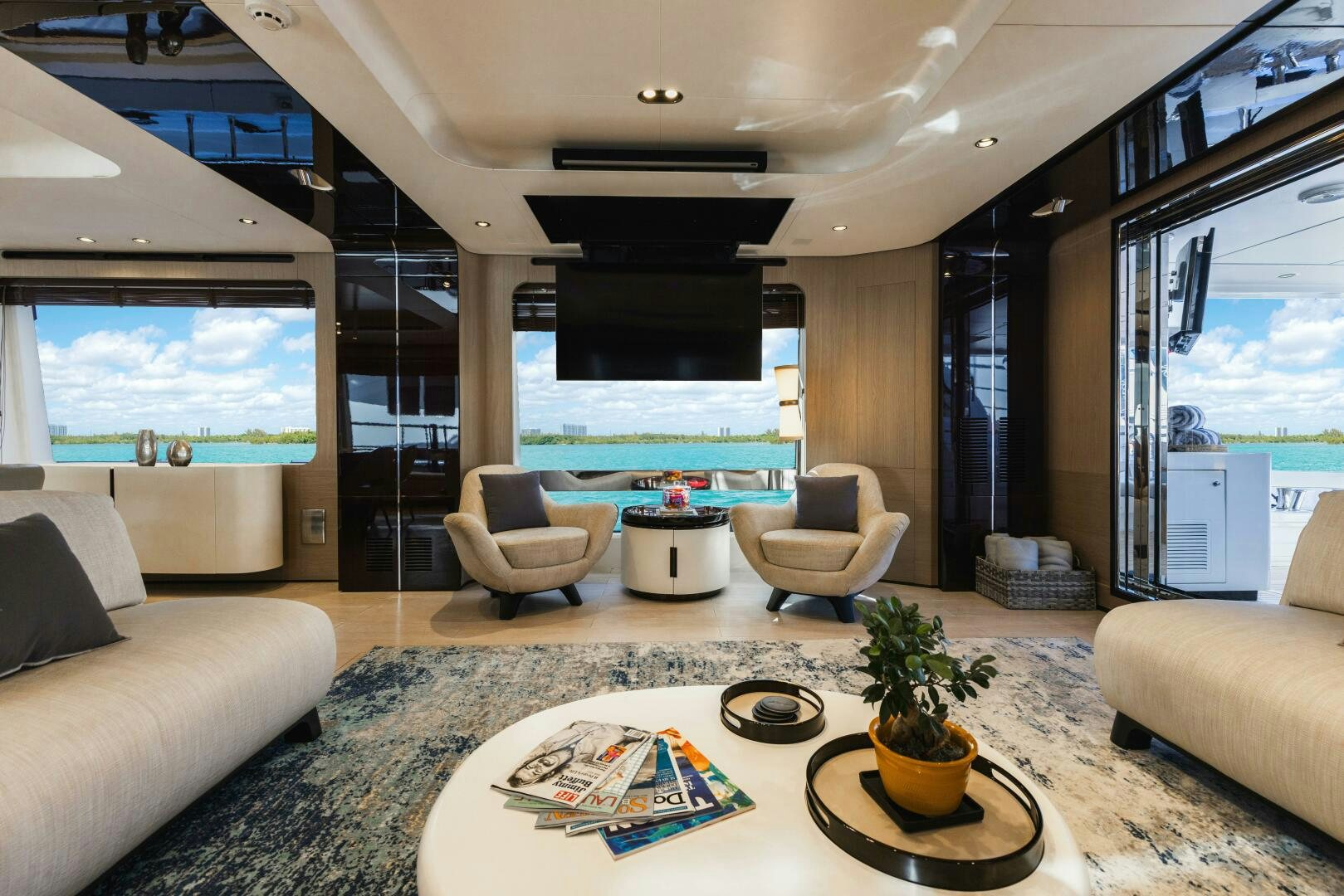 a living room with a large window aboard MAJESTIC MOMENTS Yacht for Sale