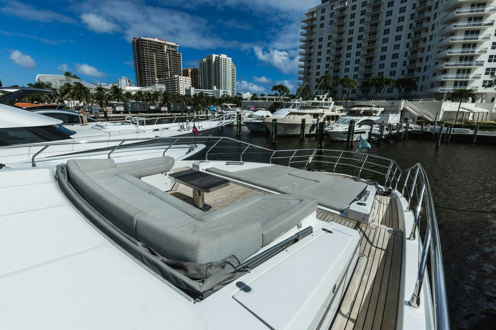 a large white boat in a harbor aboard MAJESTIC MOMENTS Yacht for Sale