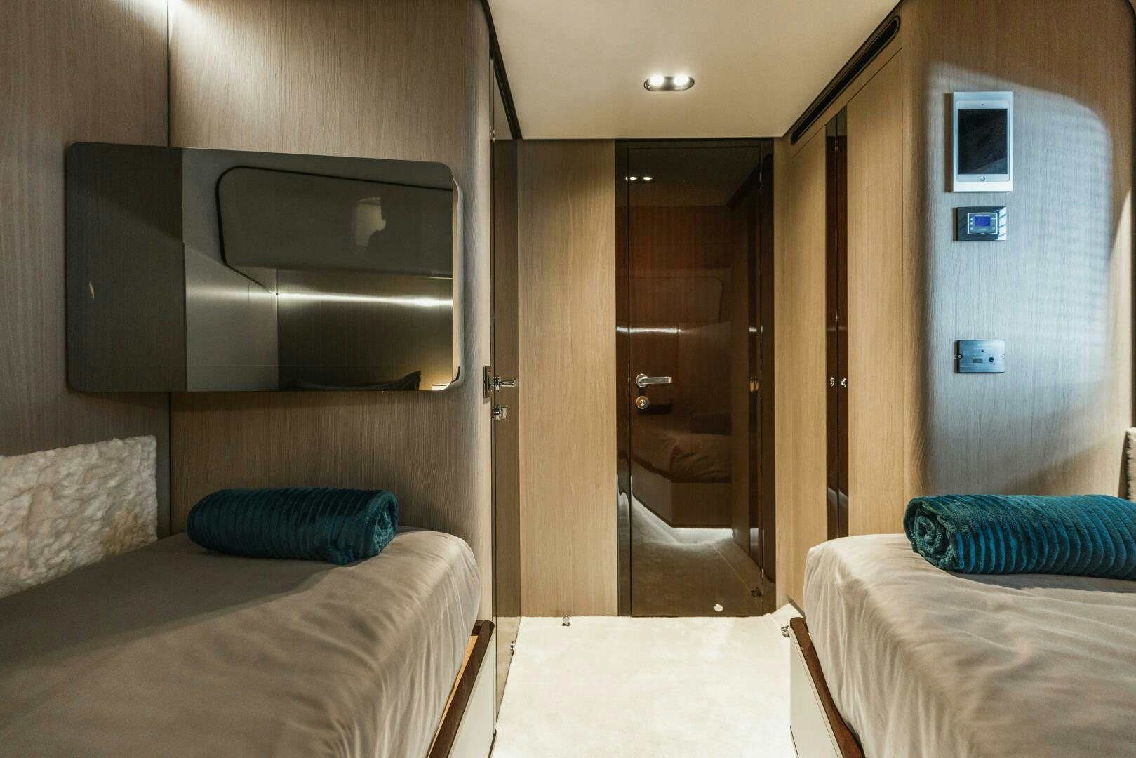 a room with a bed and a television aboard MAJESTIC MOMENTS Yacht for Sale
